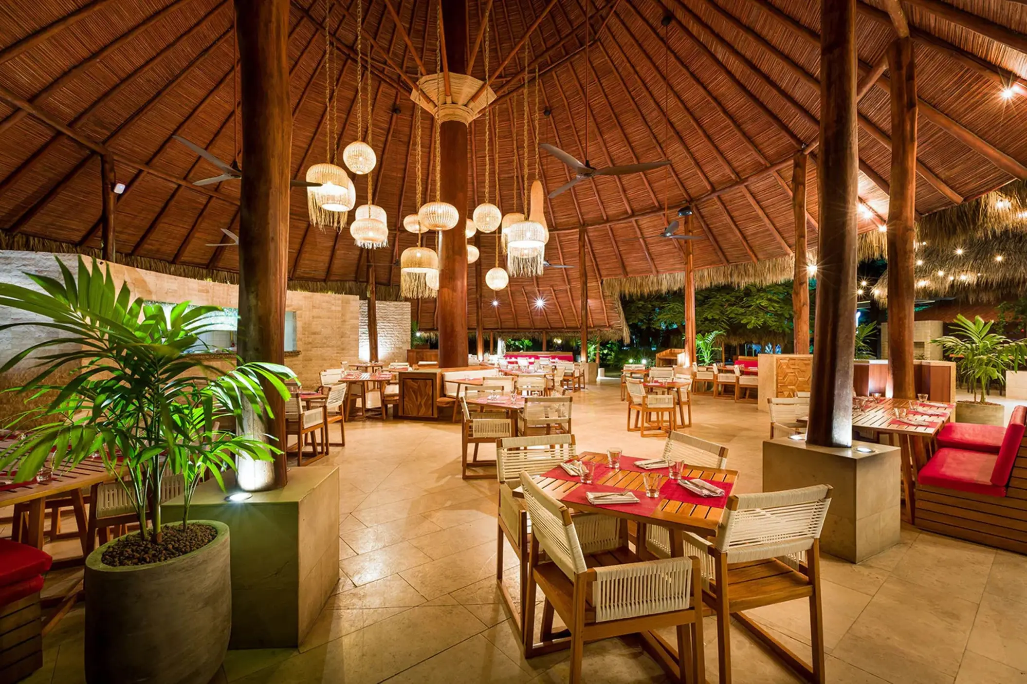 Caracola restaurant with palapa roof and lantern lighting at Westin Reserva Conchal, Liberia