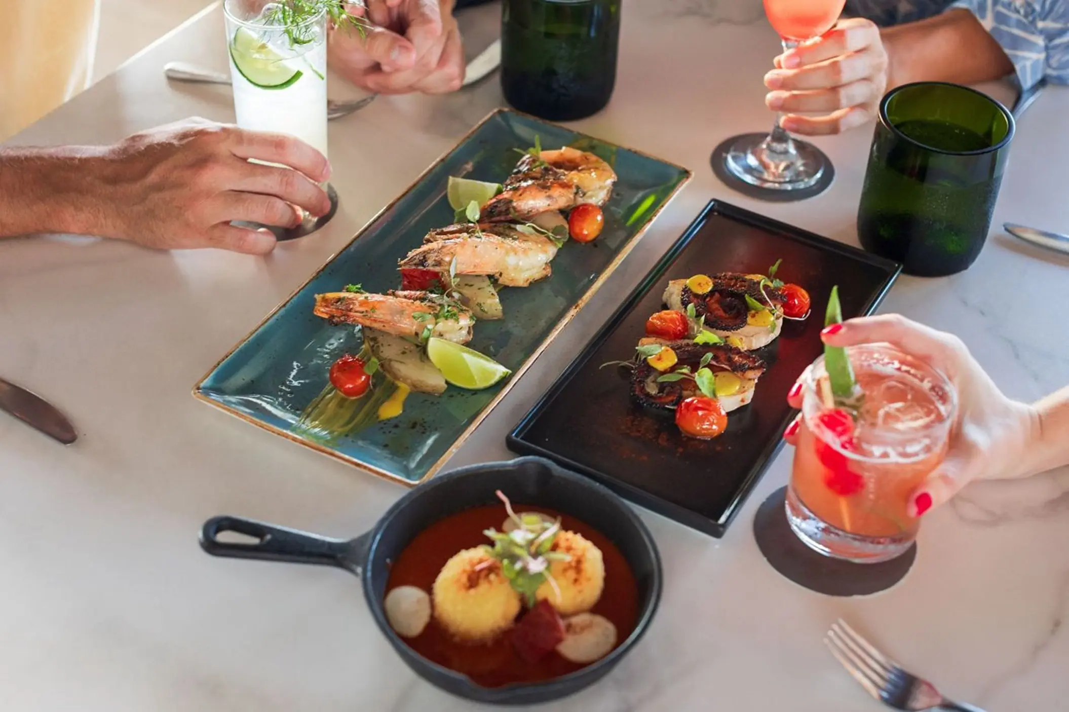 Plated appetizers and tropical cocktails at Westin Reserva Conchal, Liberia