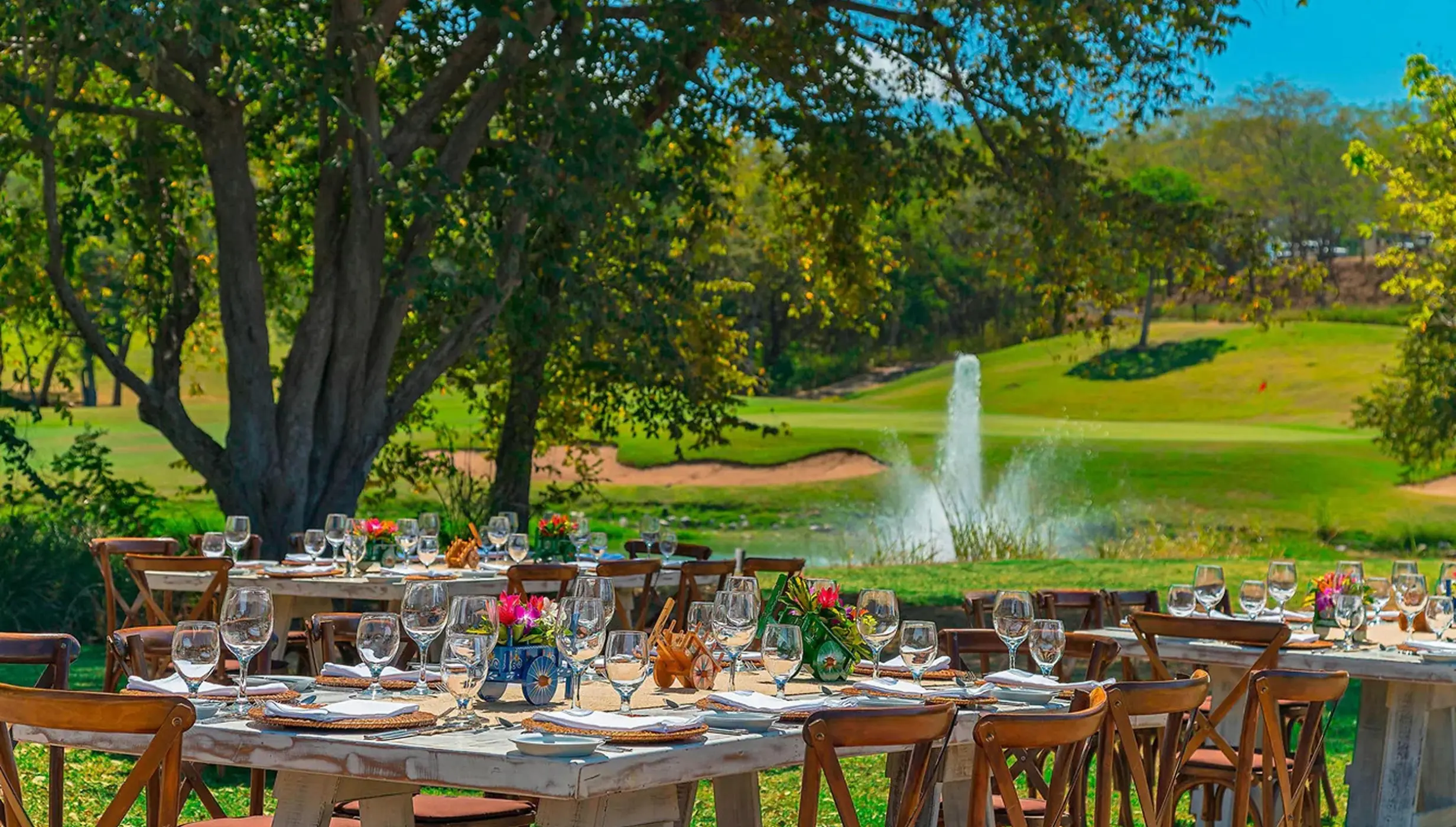 Garden wedding reception at Westin Reserva Conchal, Liberia overlooking a golf course and fountain