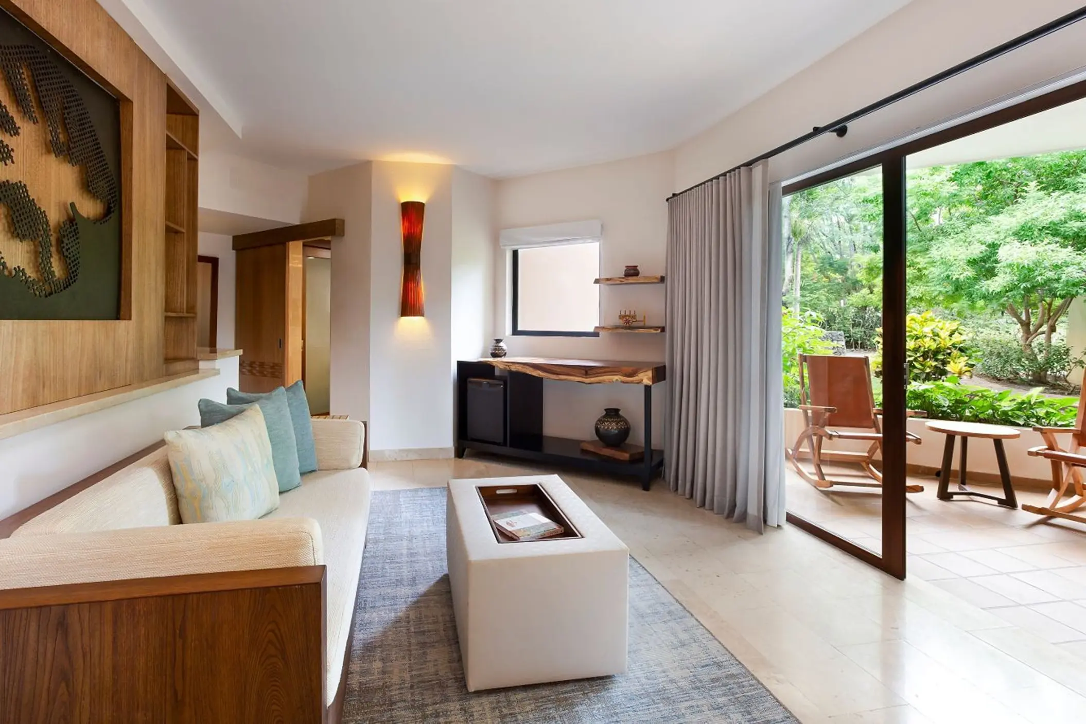 Premium Junior Suite living room opening onto a private patio at The Westin Reserva Conchal, Liberia