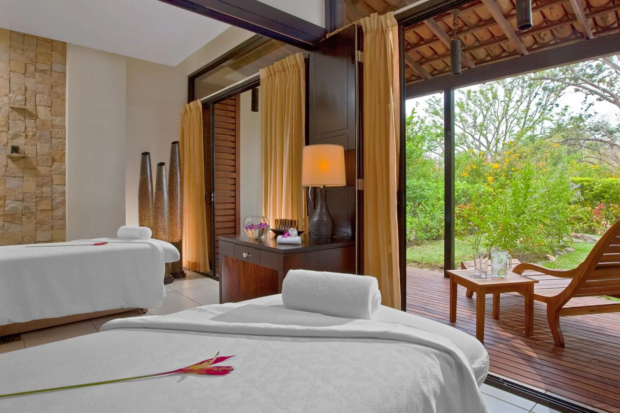 Couples massage room at The Westin Reserva Conchal opening onto a private garden patio, Liberia
