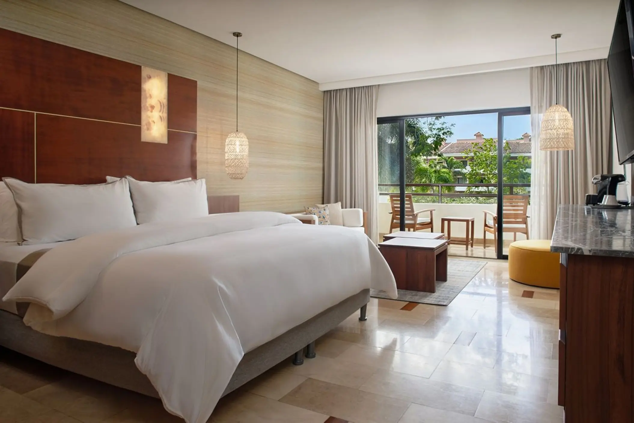 Modern guest suite with private balcony at The Westin Reserva Conchal, Liberia
