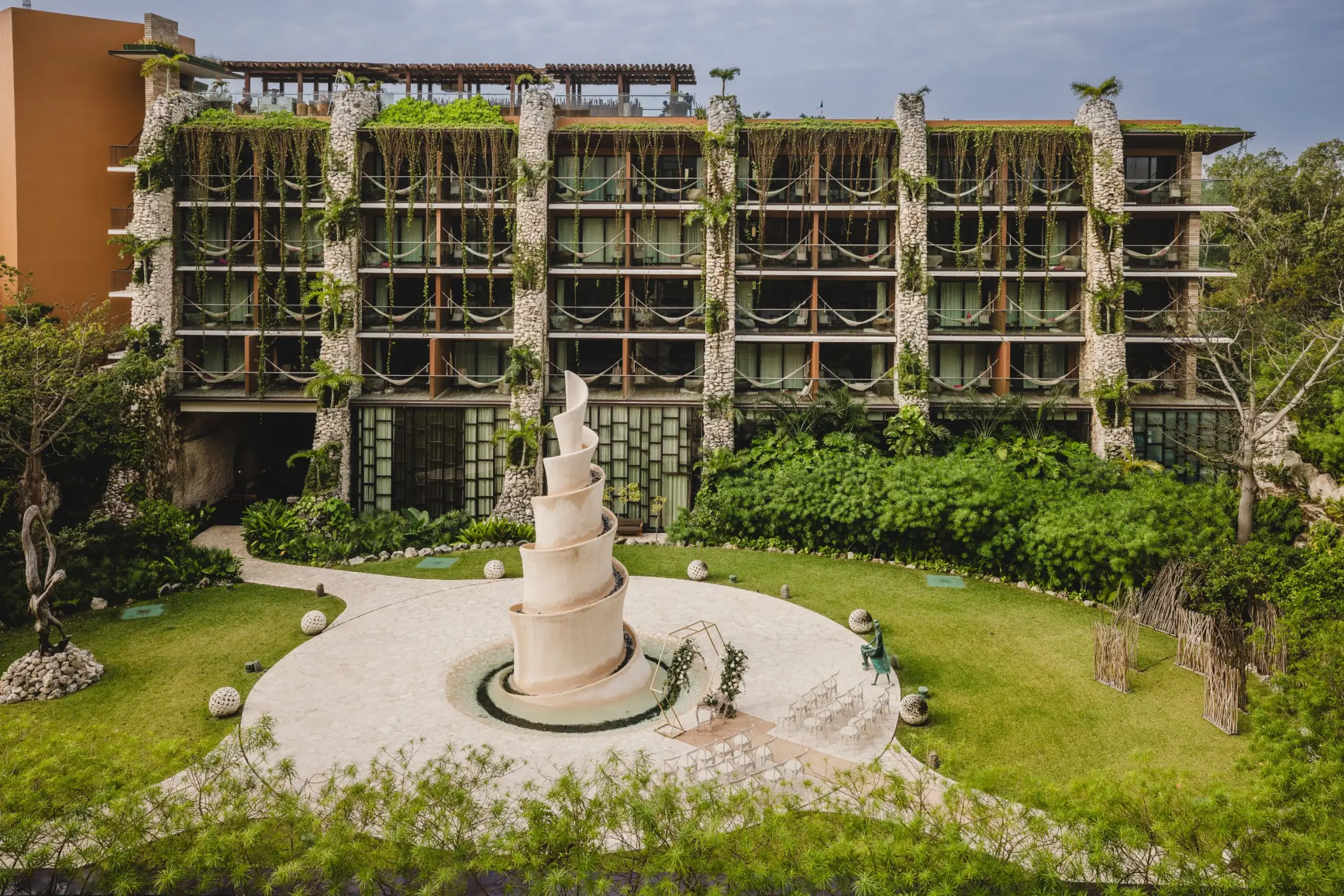 Caracol venue courtyard and stone spiral sculpture at Hotel Xcaret Arte, Riviera Maya
