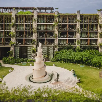 Caracol venue courtyard and stone spiral sculpture at Hotel Xcaret Arte, Riviera Maya