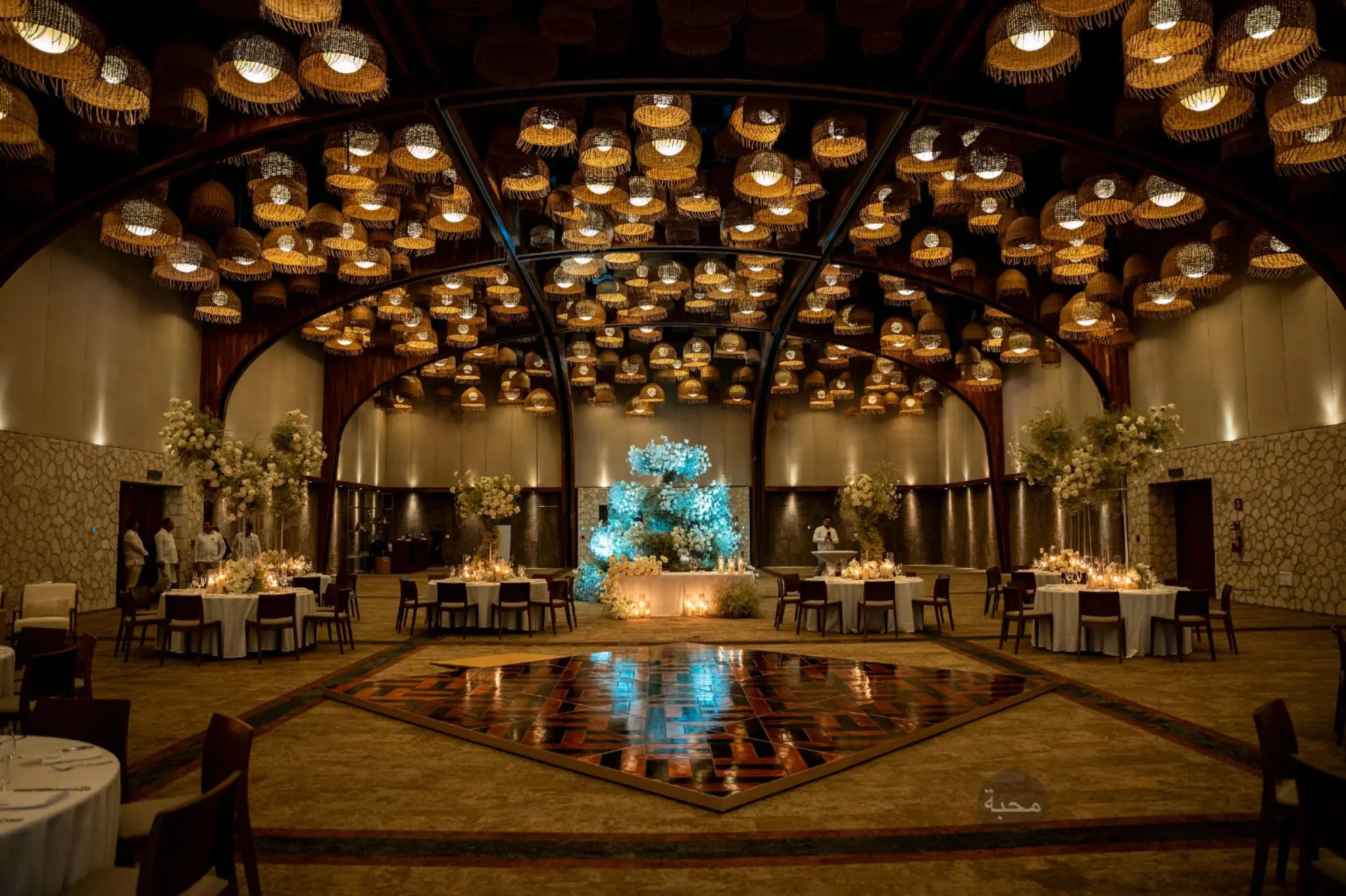 Diego Ballroom wedding reception with hanging lanterns and dance floor at Hotel Xcaret Arte, Riviera Maya