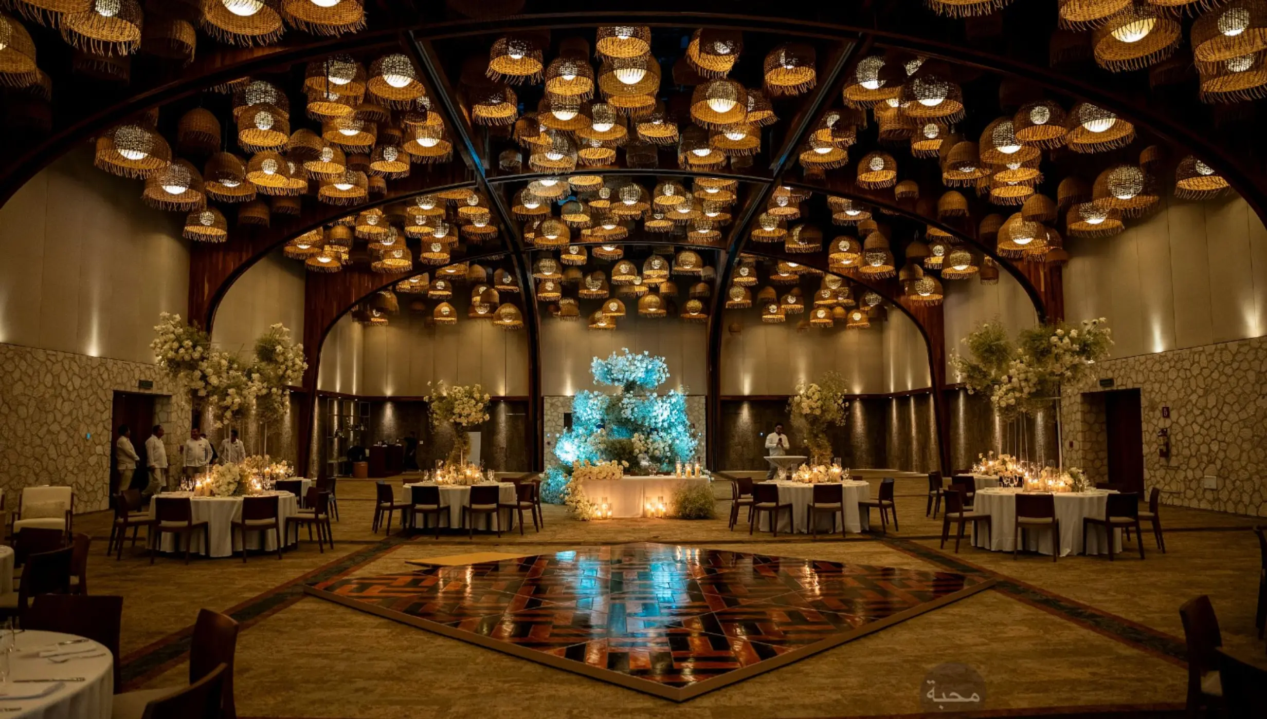 Diego Ballroom wedding reception with hanging lanterns and dance floor at Hotel Xcaret Arte, Riviera Maya