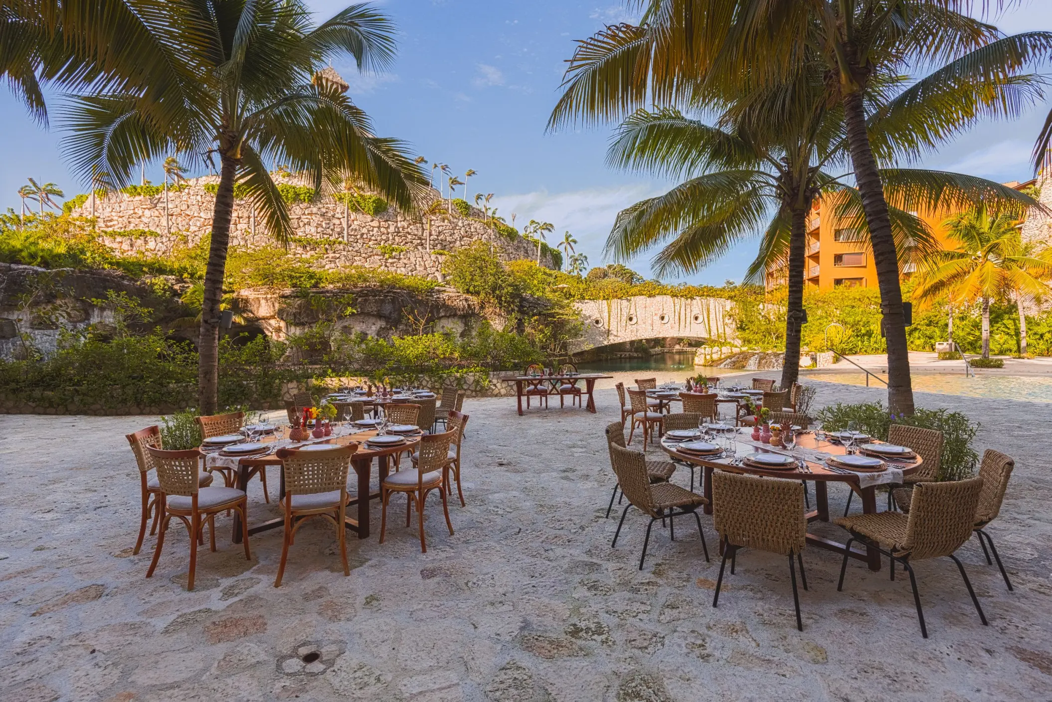 Outdoor wedding reception tables at Hotel Xcaret Arte, Riviera Maya