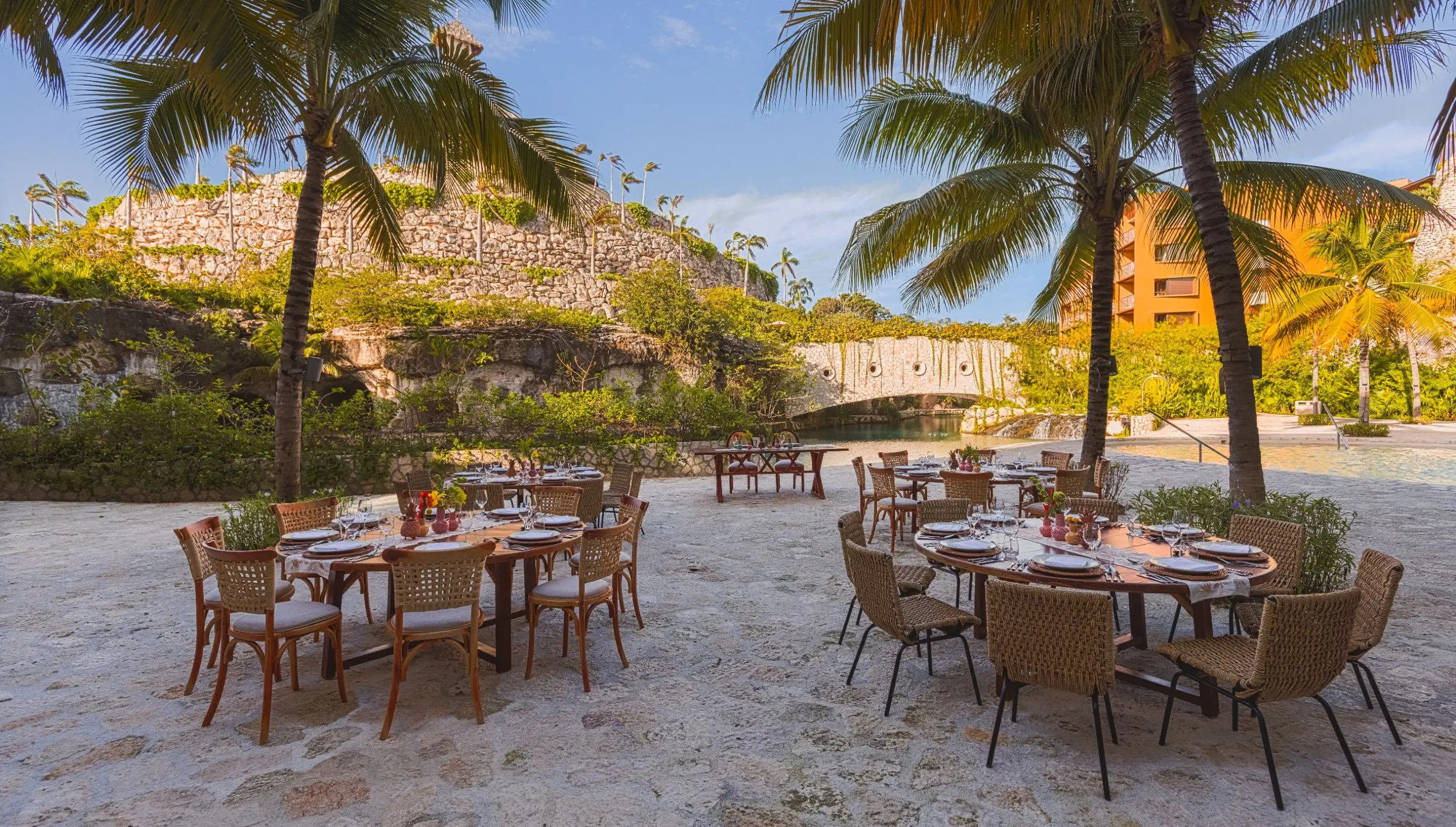 Outdoor wedding reception tables at Hotel Xcaret Arte, Riviera Maya