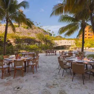 Outdoor wedding reception tables at Hotel Xcaret Arte, Riviera Maya