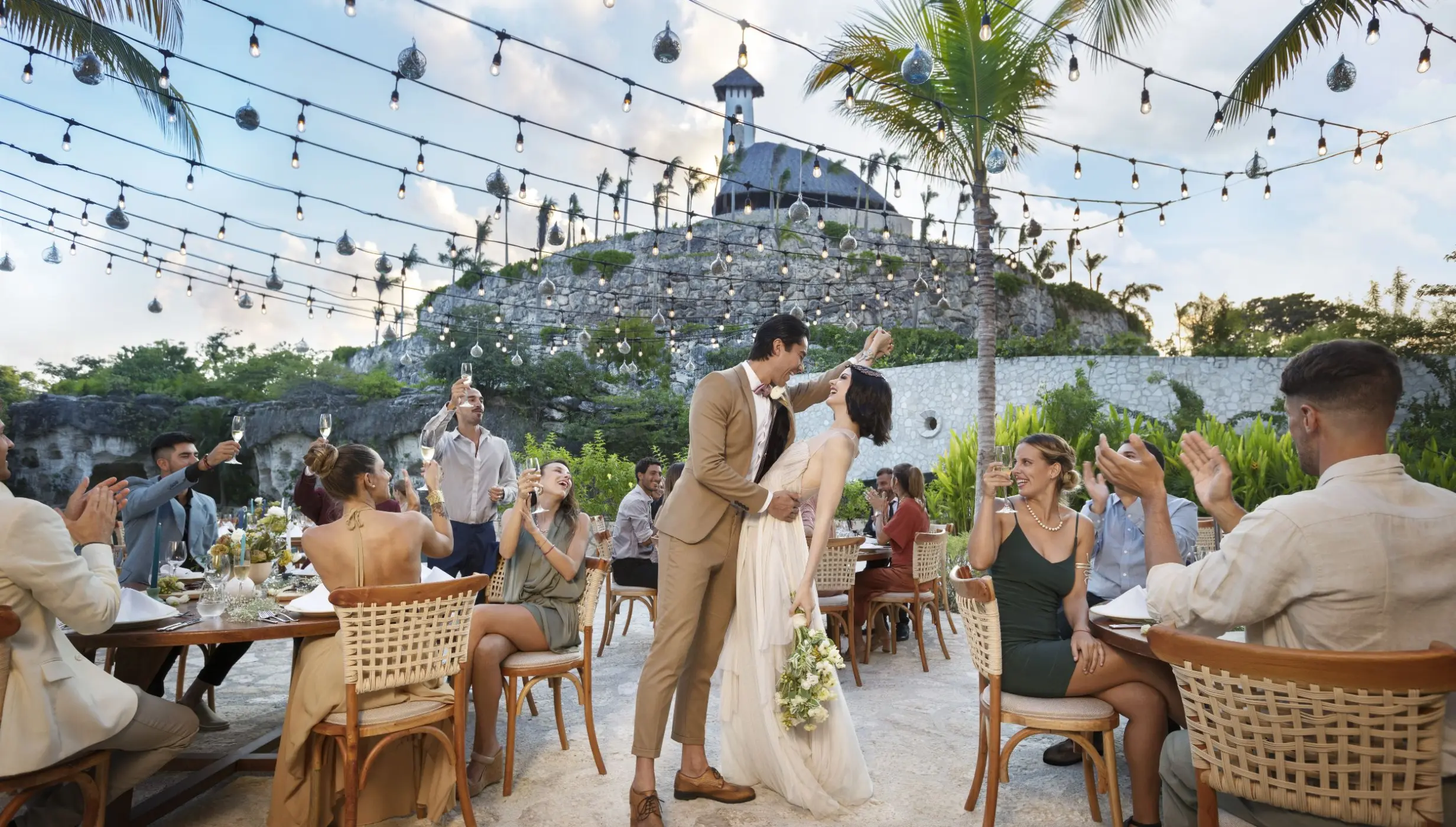 Wedding reception under string lights at Hotel Xcaret Arte, Riviera Maya