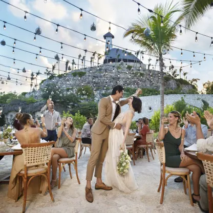 Wedding reception under string lights at Hotel Xcaret Arte, Riviera Maya