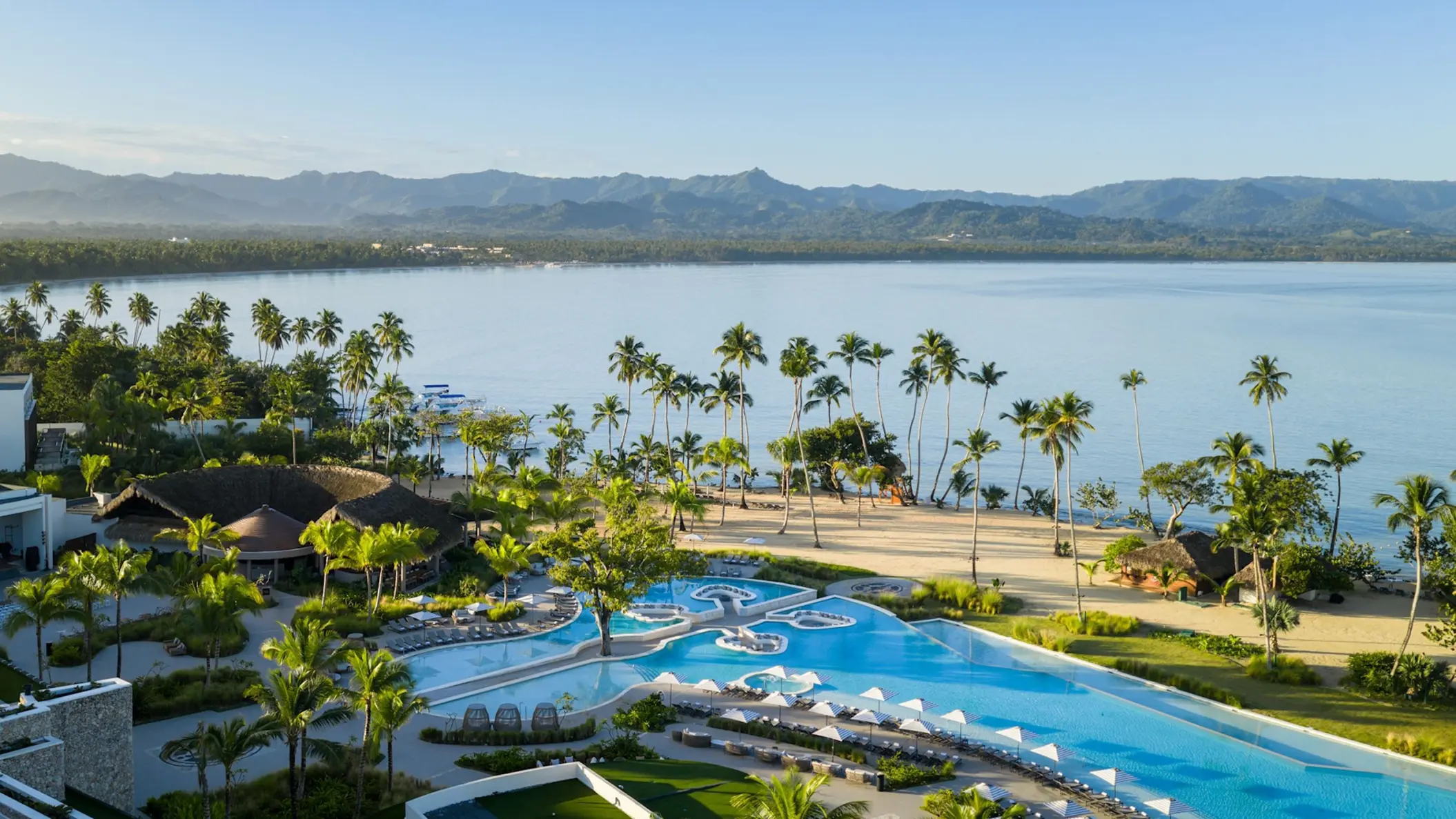 Zemi Miches infinity pool and beachfront with palm trees, Punta Cana