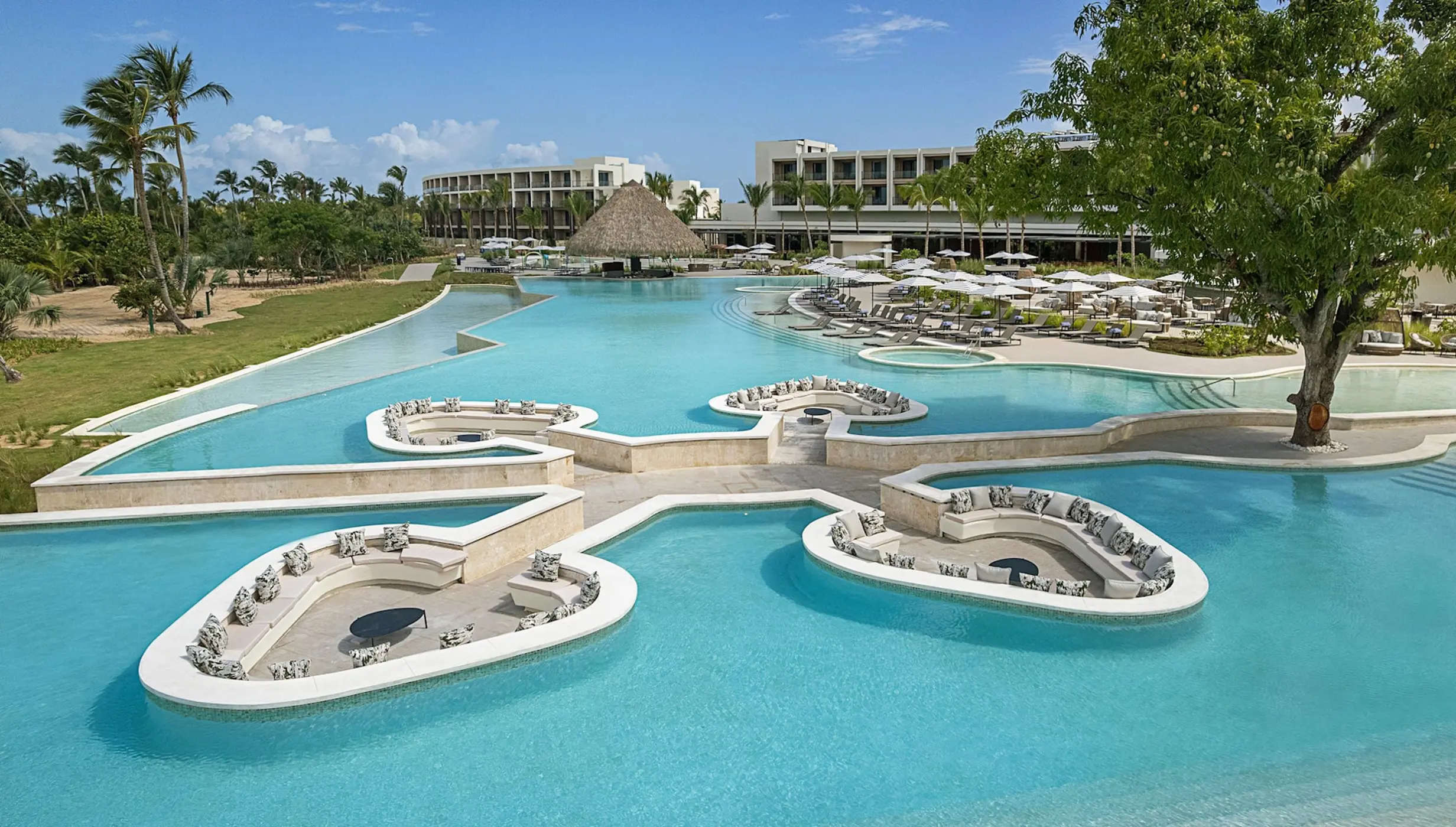 Zemi Miches main pool with sunken seating areas and swim-up bar, Punta Cana