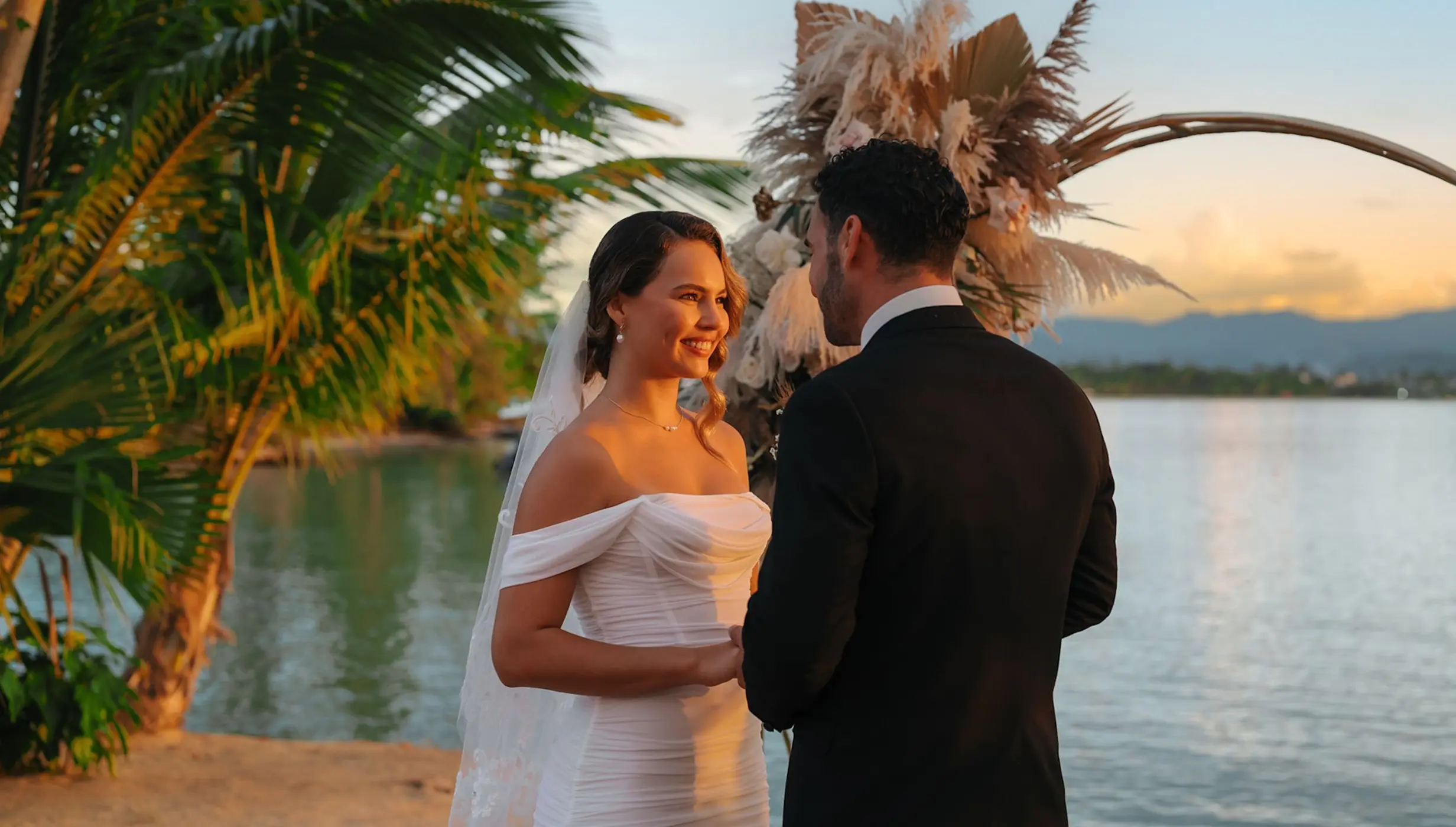 The bride and groom exchange vows during a sunset ceremony at Zemi Miches, Punta Cana