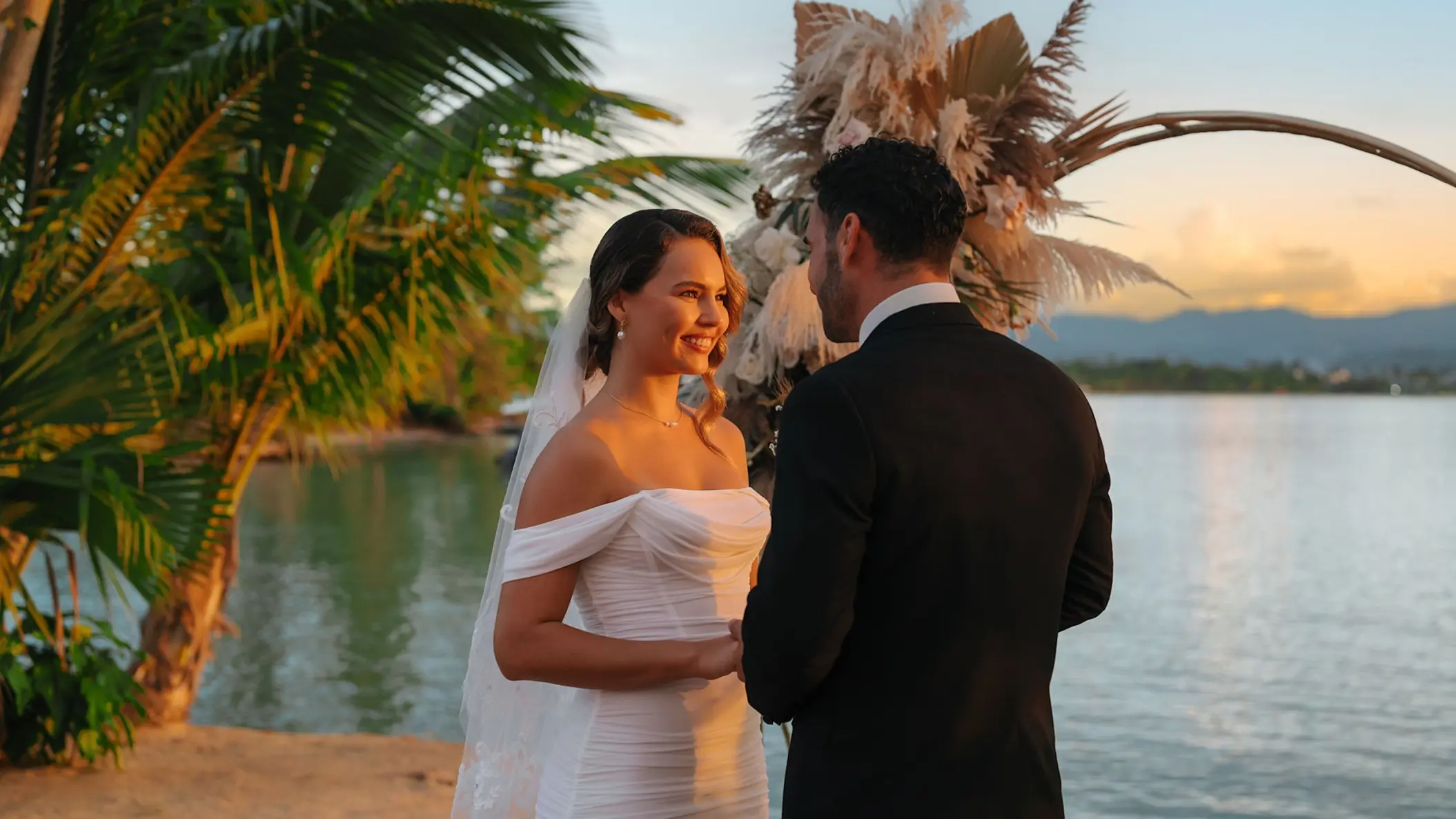 The bride and groom exchange vows during a sunset ceremony at Zemi Miches, Punta Cana