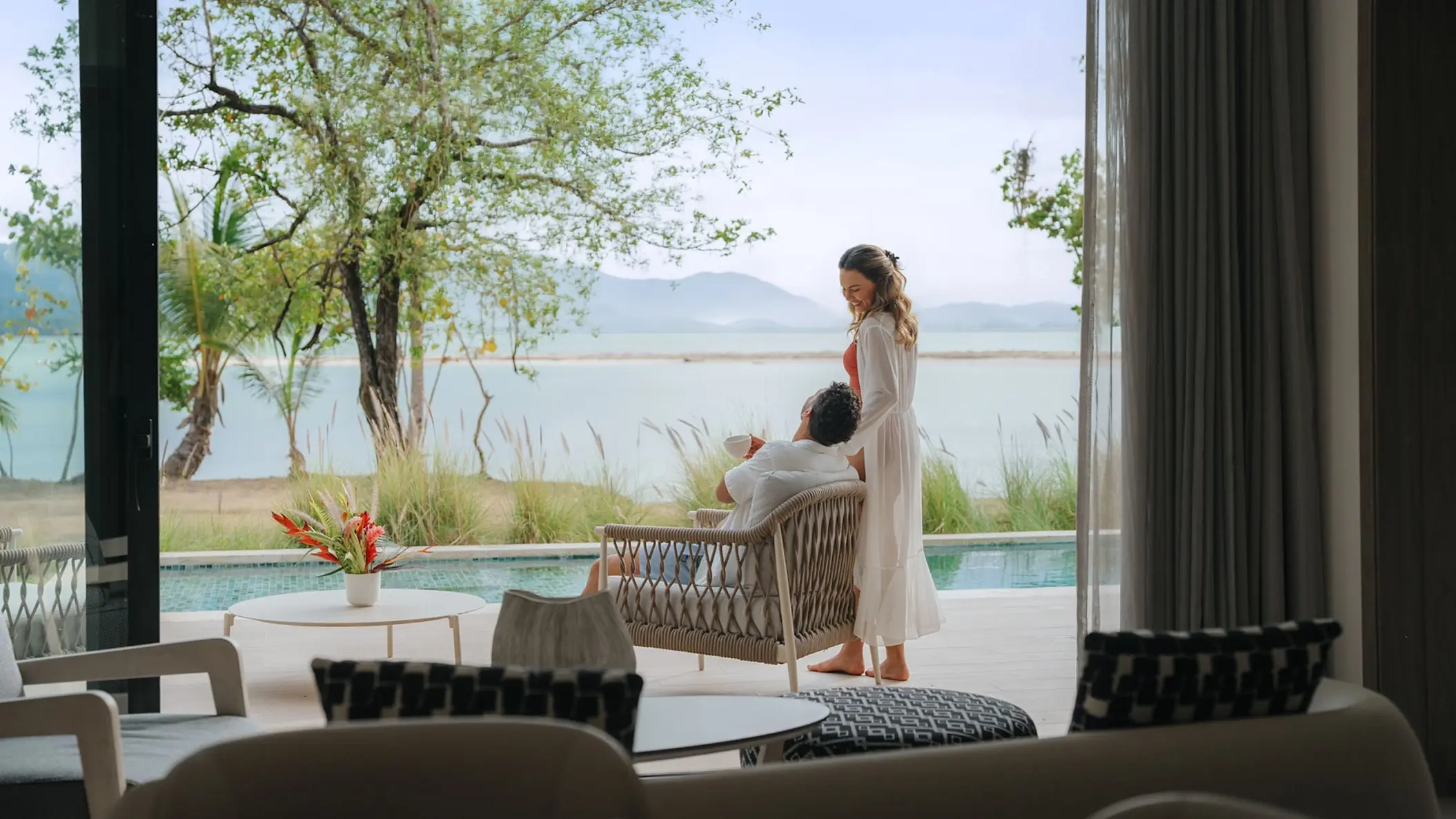 Couple relaxing on a bungalow terrace with a private pool at Zemi Miches, Punta Cana