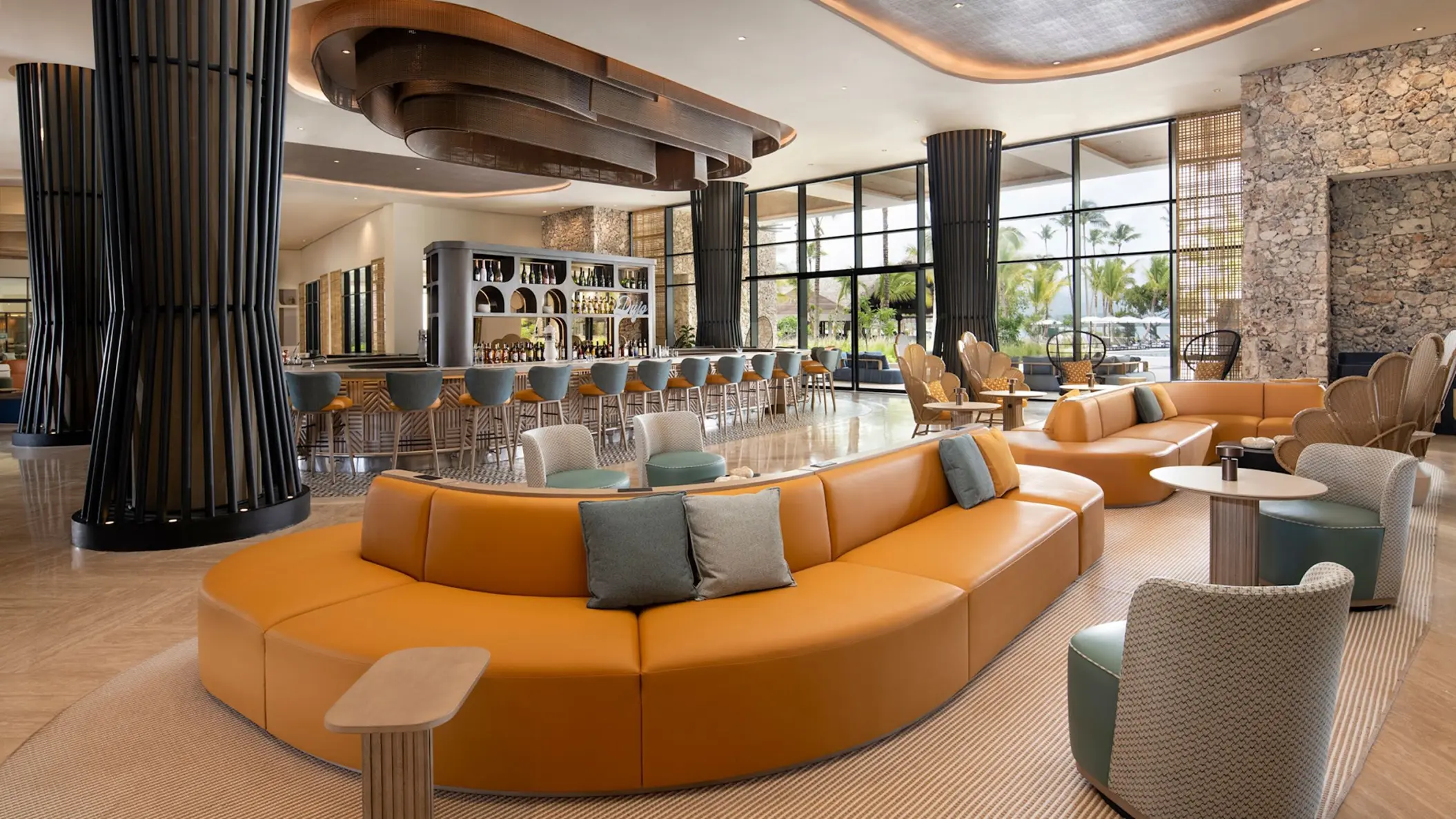 Zemi Miches lobby bar and lounge area with curved orange seating, Punta Cana