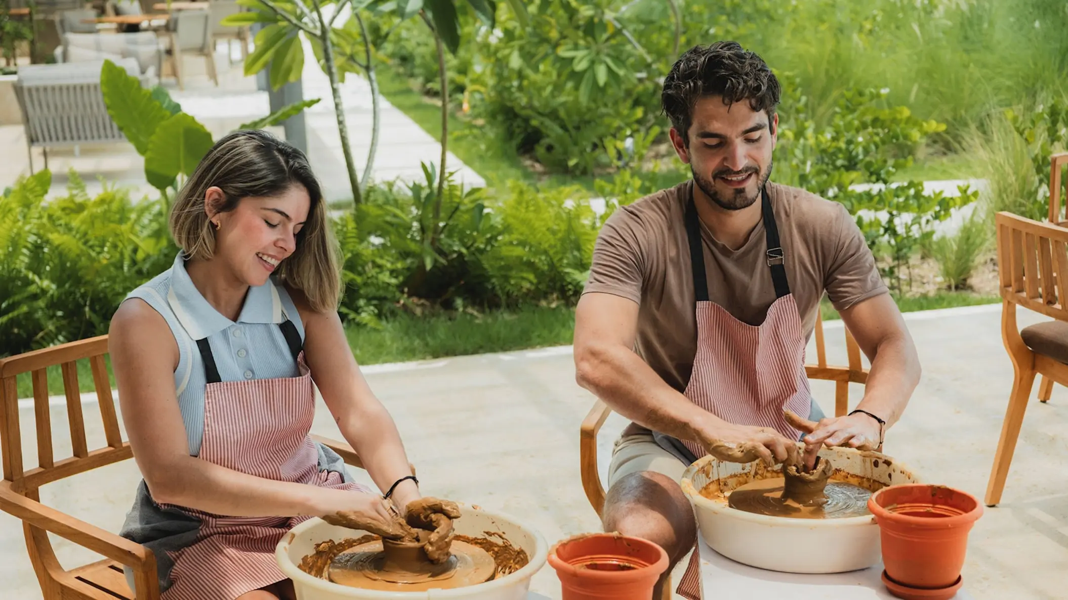 Couple participating in a clay pottery activity at Zemi Miches, Punta Cana