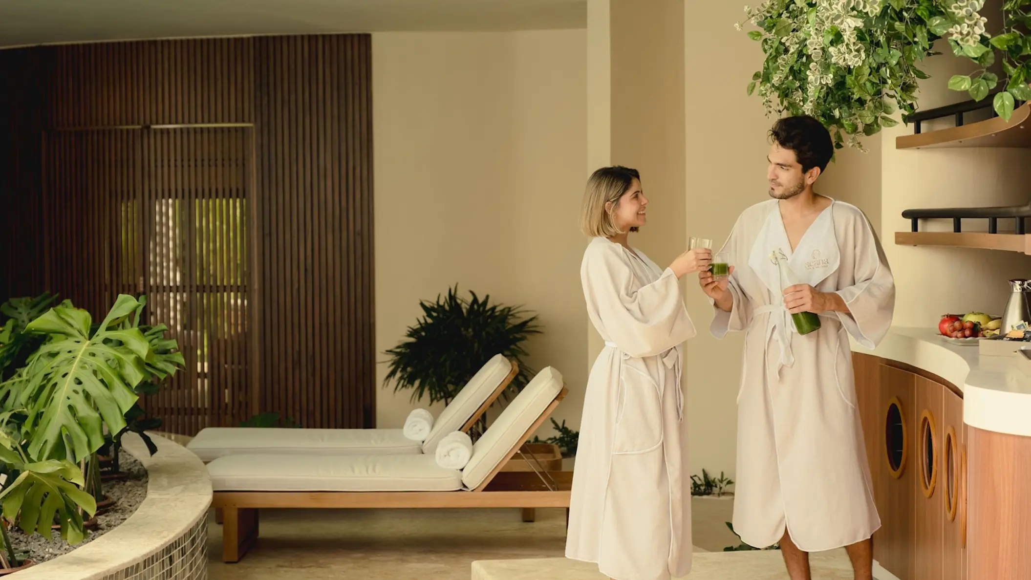 Couple in robes enjoying drinks at Zemi Miches, Punta Cana