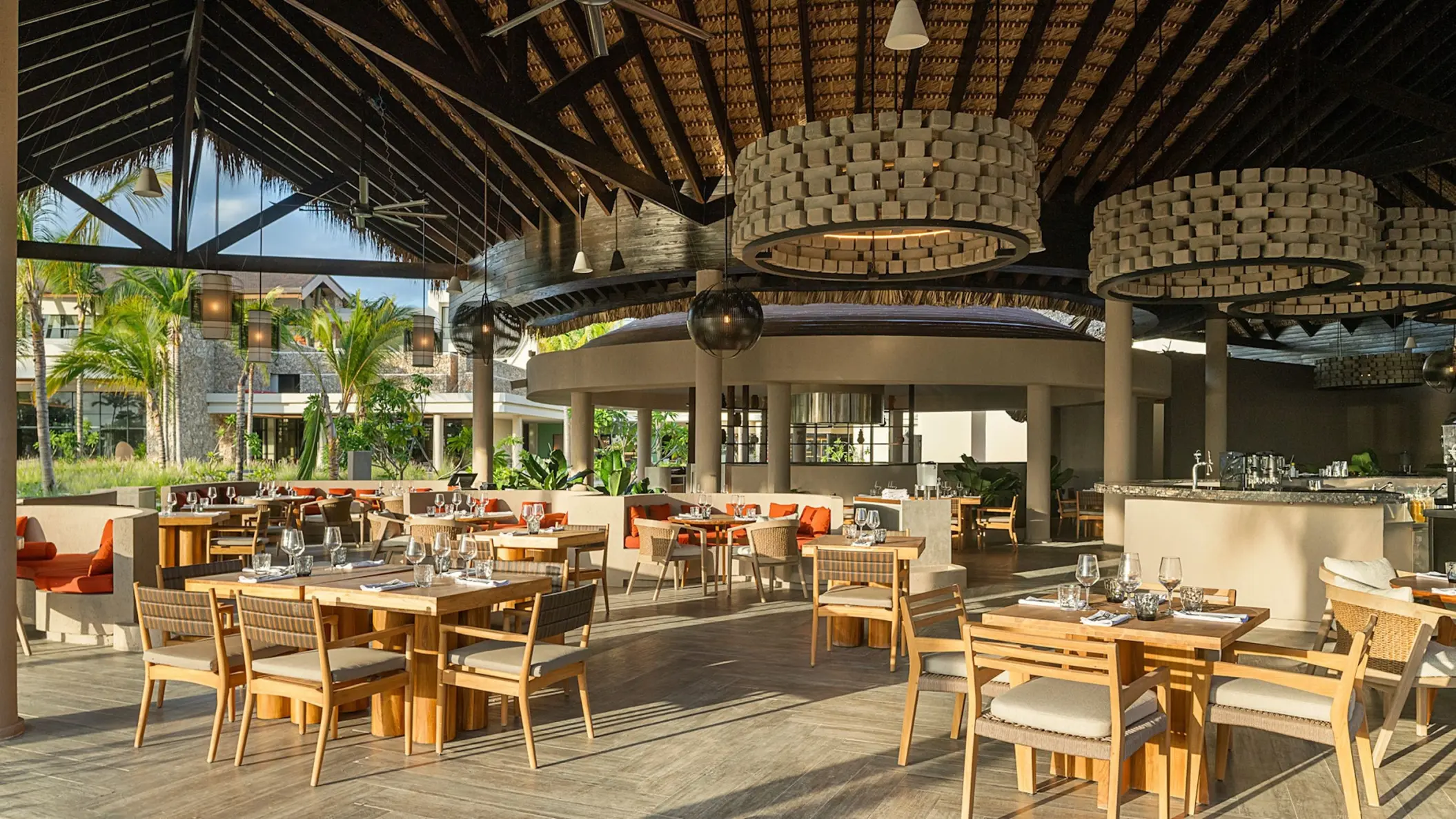 Yuca restaurant dining area under a thatched roof at Zemi Miches, Punta Cana