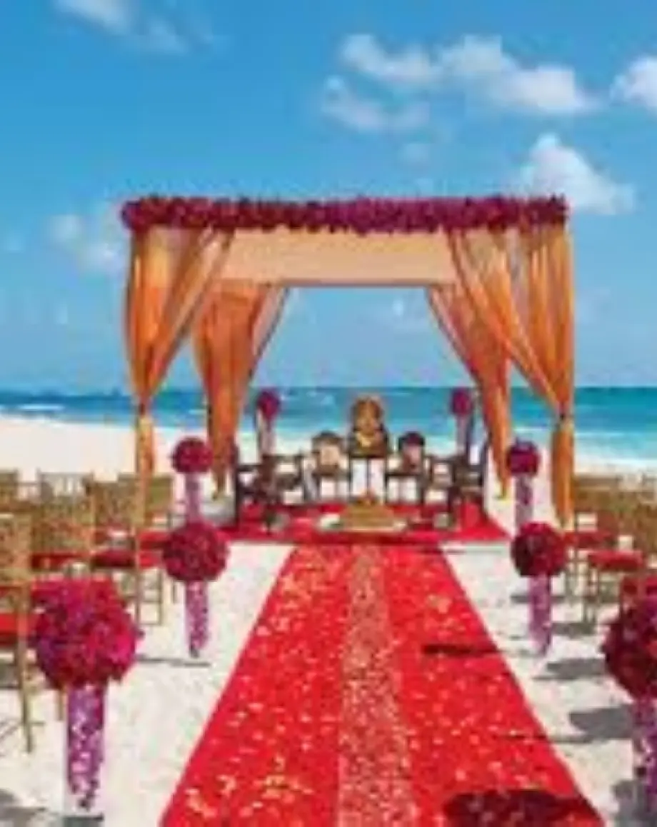 South Asian beach ceremony setup with a Mandap at Zoetry Agua, Punta Cana