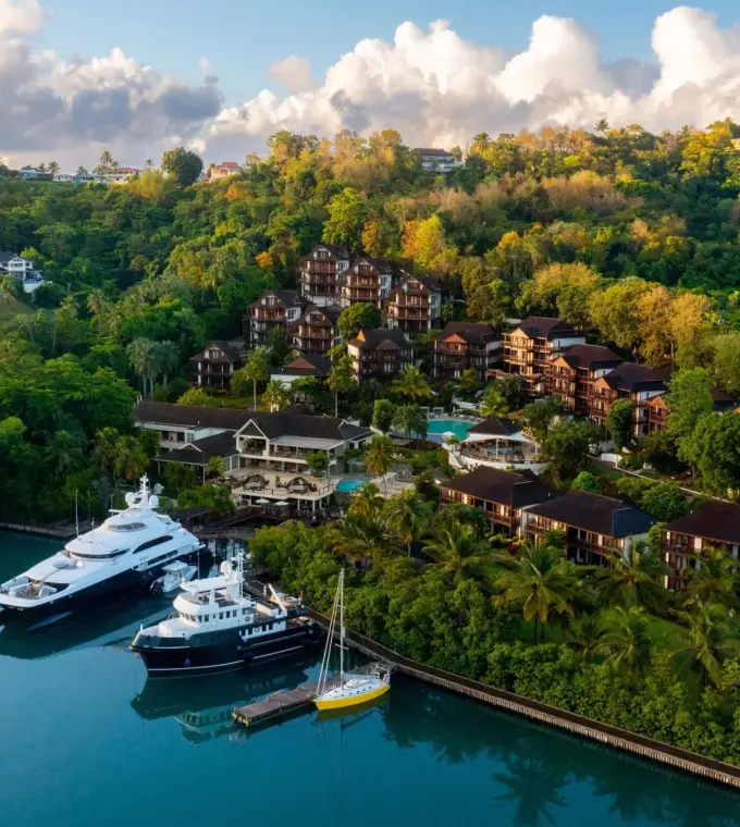 Aerial view of Zoetry Marigot Bay buildings and yachts in the marina, Castries