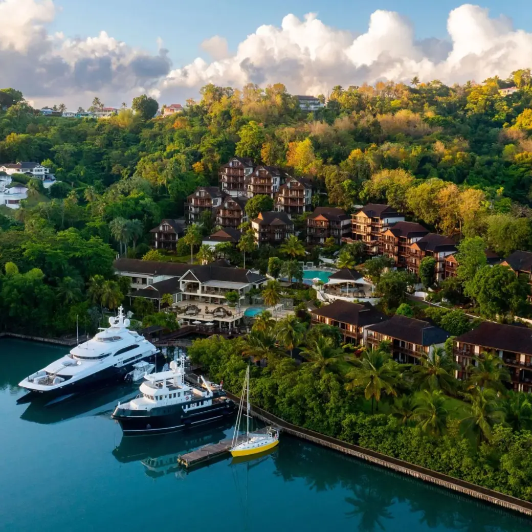 Aerial view of Zoetry Marigot Bay buildings and yachts in the marina, Castries