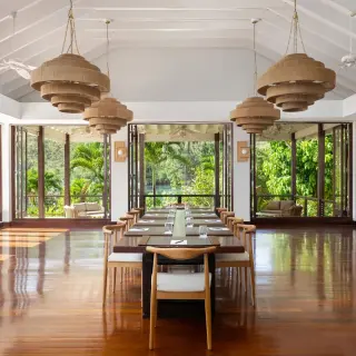 Boudreau meeting room with long wooden table and woven chandeliers at Zoetry Marigot Bay, Castries