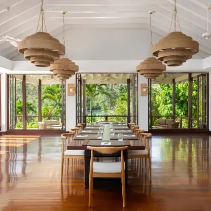 Boudreau meeting room with long wooden table and woven chandeliers at Zoetry Marigot Bay, Castries