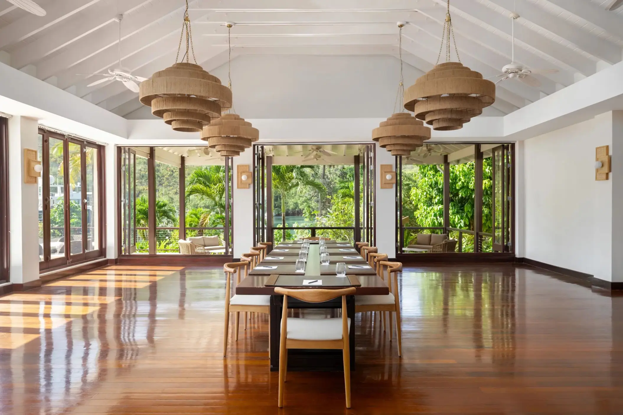 Boudreau meeting room with long wooden table and woven chandeliers at Zoetry Marigot Bay, Castries