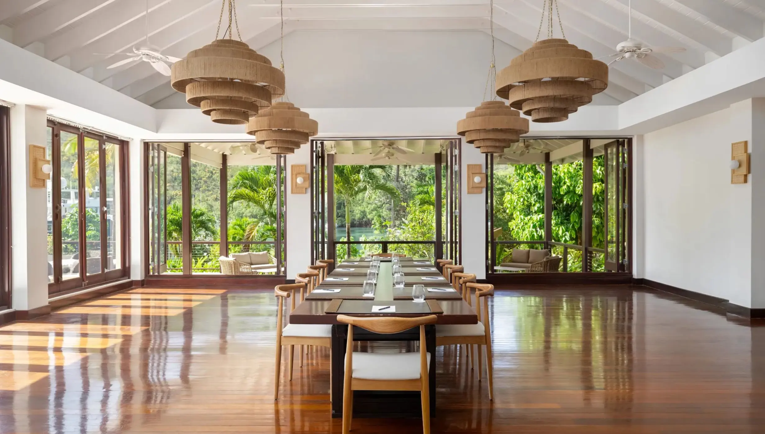 Boudreau meeting room with long wooden table and woven chandeliers at Zoetry Marigot Bay, Castries