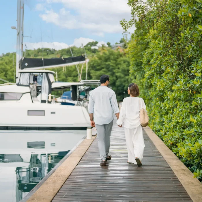 couple walking down the marina at Zoetry Marigot Bay St. Lucia
