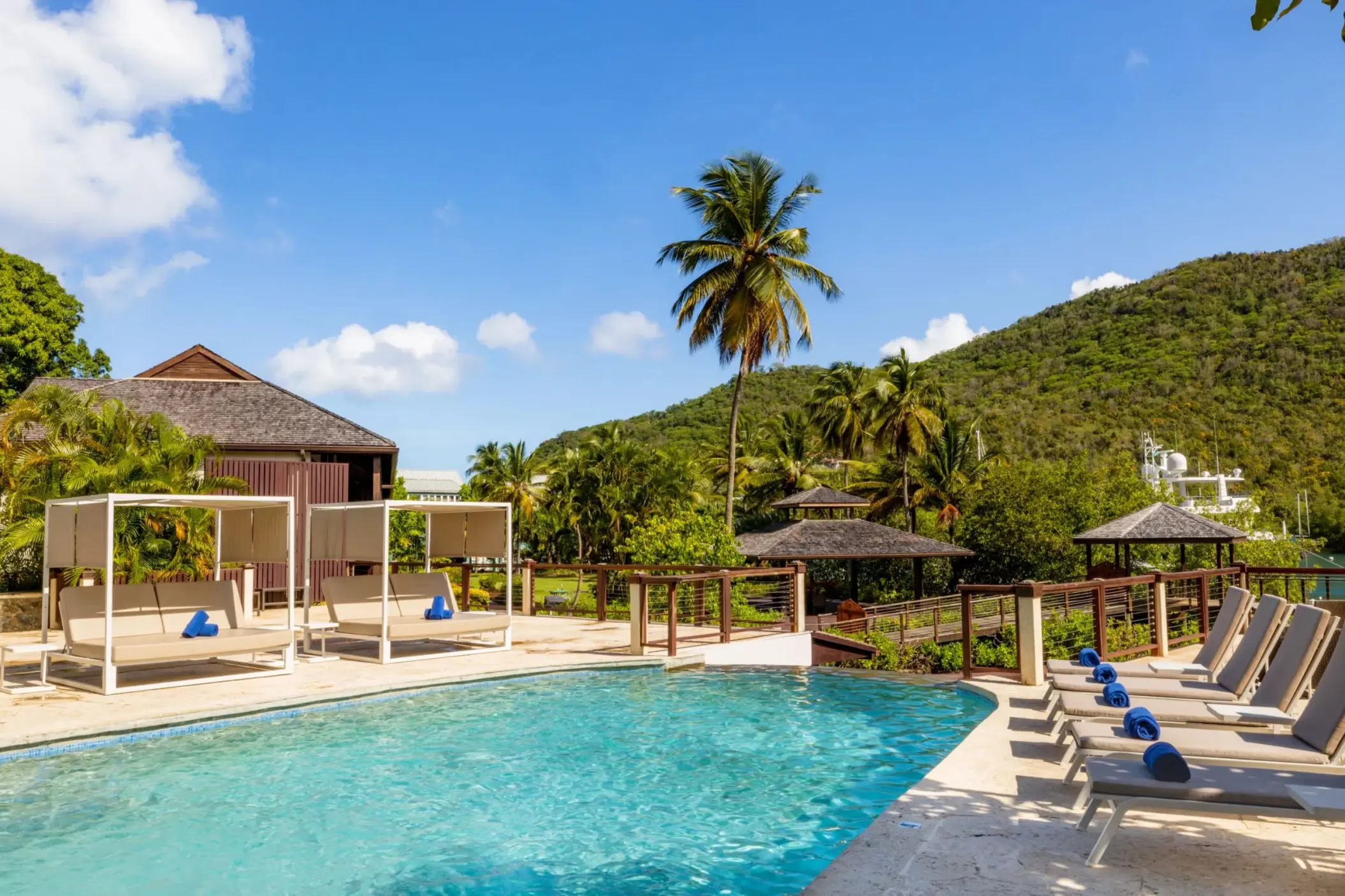 Infinity pool with cabanas and lounge chairs at Zoetry Marigot Bay, Castries