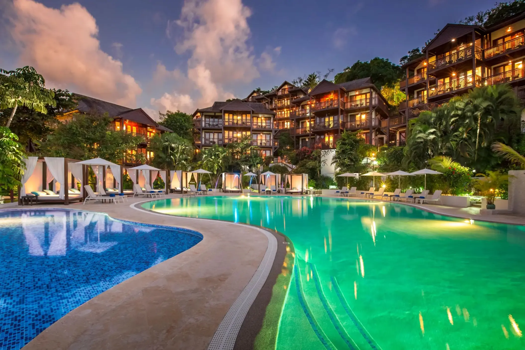 Main pool and lit hillside suites at night, Zoetry Marigot Bay, Castries