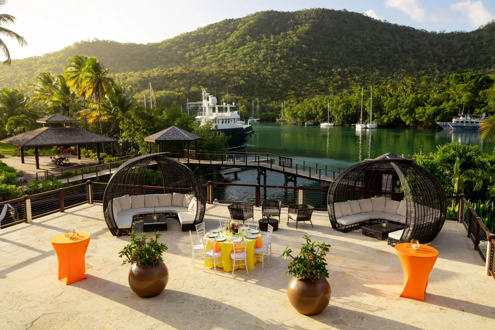 Outdoor observation deck wedding reception setup at Zoëtry Marigot Bay overlooking the marina, Castries