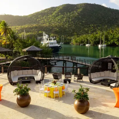 Outdoor observation deck wedding reception setup at Zoëtry Marigot Bay overlooking the marina, Castries