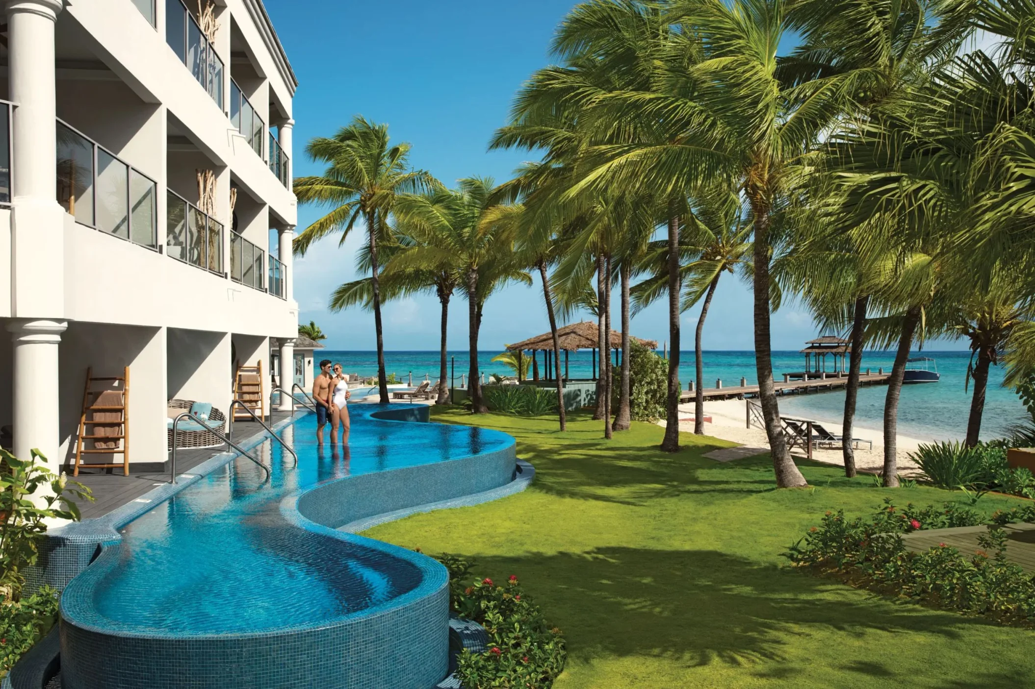 exterior of swim out suites with view of the beach and sea at Zoetry Montego Bay