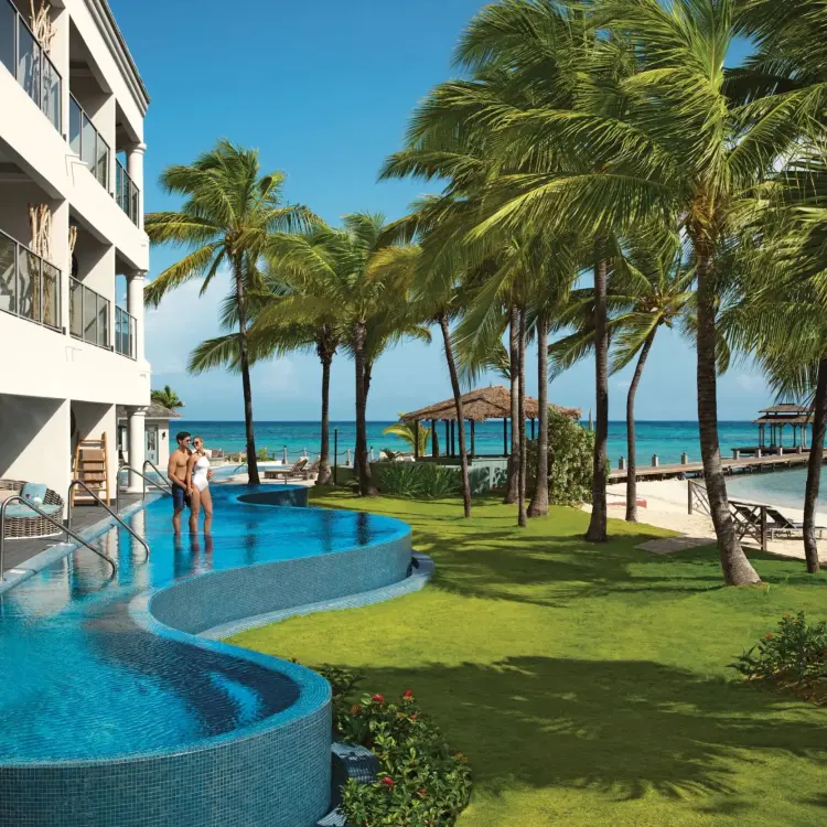 Swim-out suites and infinity pool at Zoetry Montego Bay overlooking the Caribbean Sea