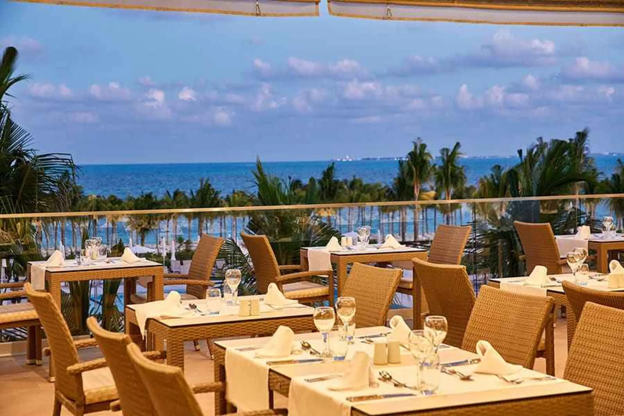 Outdoor restaurant terrace with ocean views at Riu Palace Costa Mujeres, Cancun