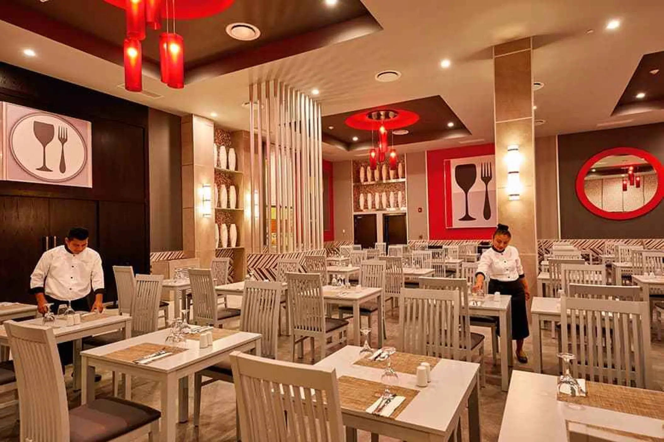 Modern restaurant dining room with red accents at Riu Palace Costa Mujeres, Cancun
