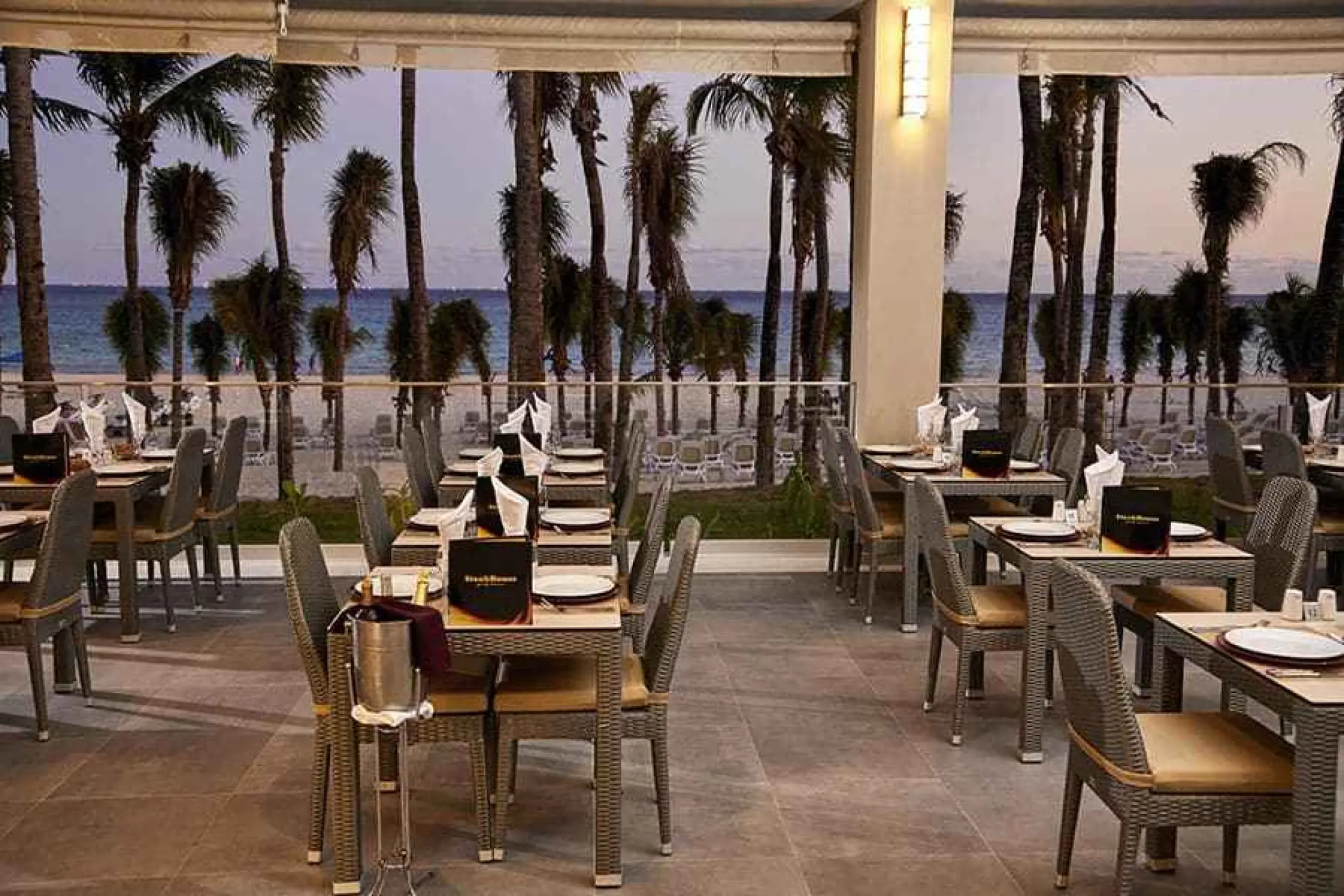 Outdoor steakhouse terrace with ocean views at Riu Palace Riviera Maya, Playa Del Carmen