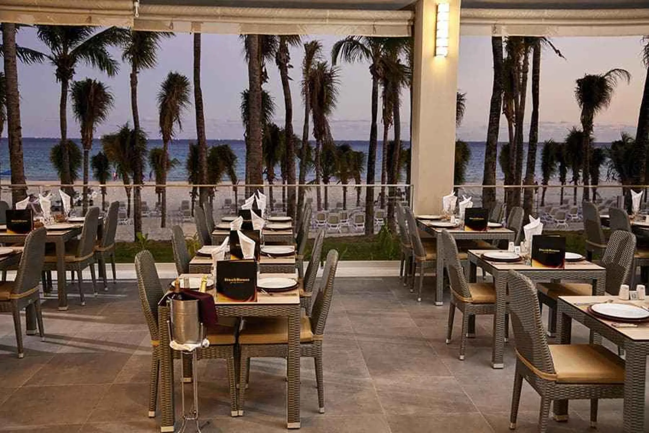 Outdoor steakhouse terrace with ocean views at Riu Palace Riviera Maya, Playa Del Carmen