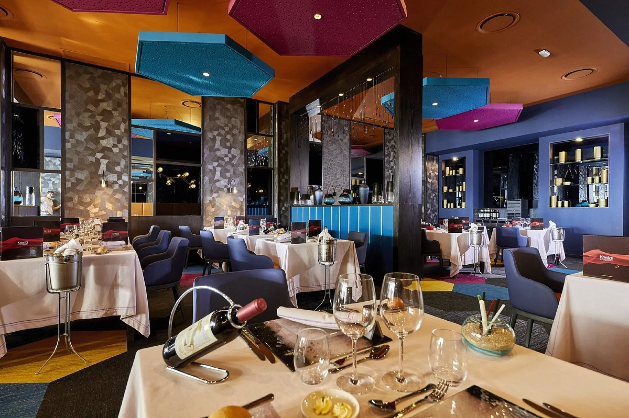 Fusion restaurant with colorful geometric ceiling decor at Riu Palace Baja California, Cabo San Lucas