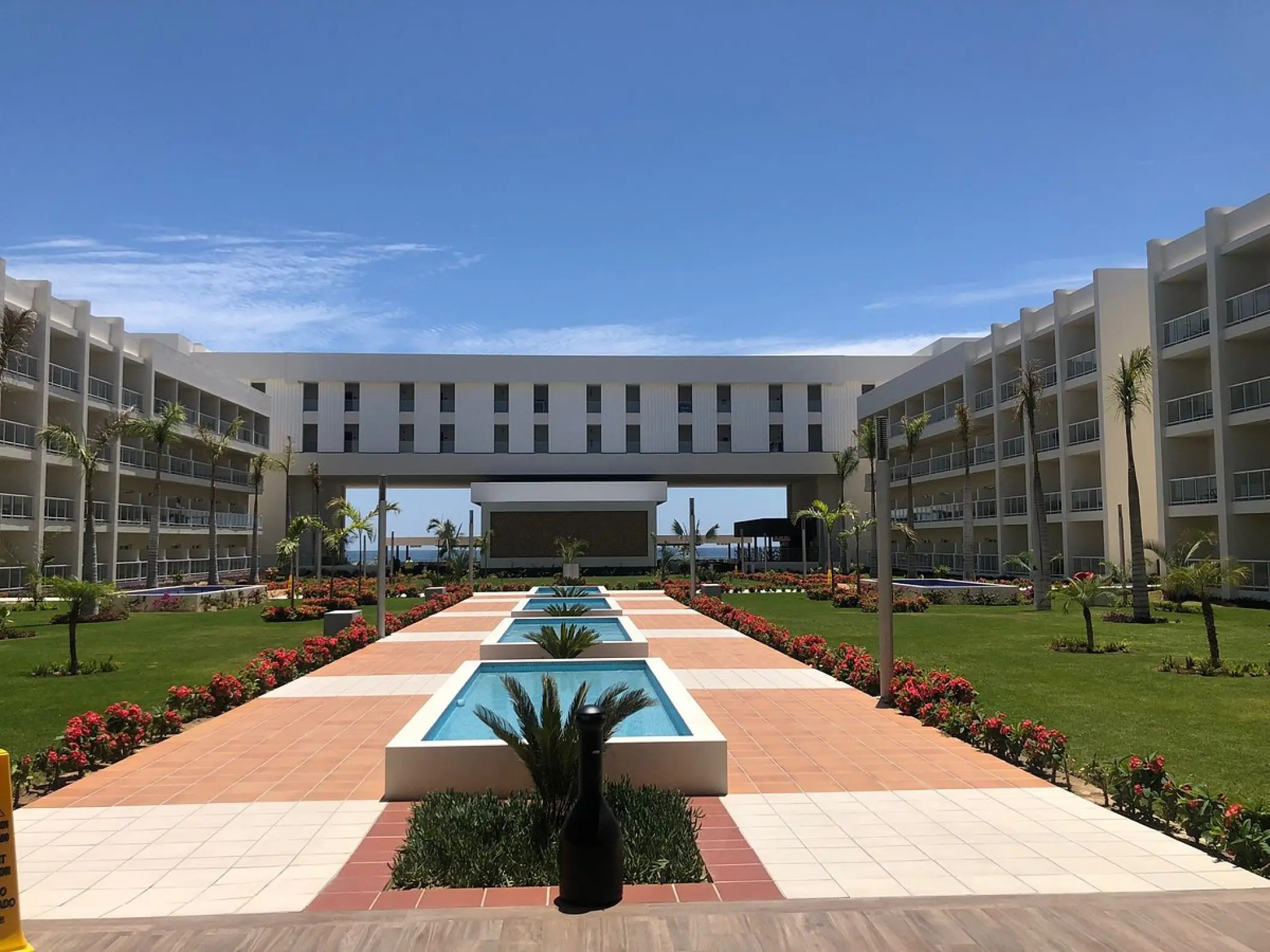 Modern courtyard with tiered fountains and manicured lawns at Riu Palace Baja California, Cabo San Lucas