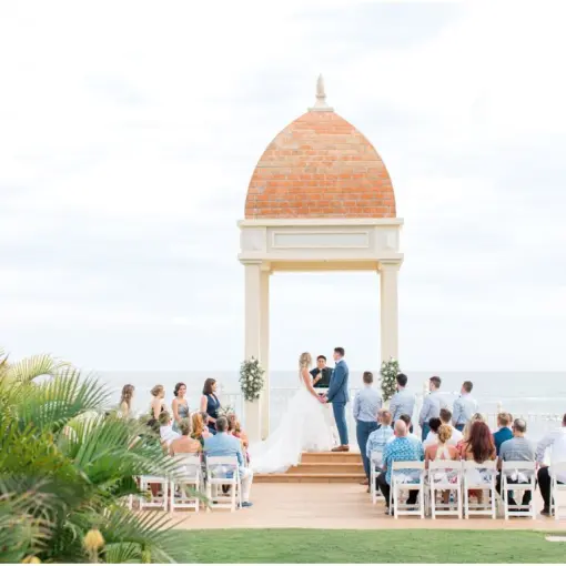 Wedding ceremony under a domed gazebo overlooking the ocean at Riu Palace Cabo San Lucas