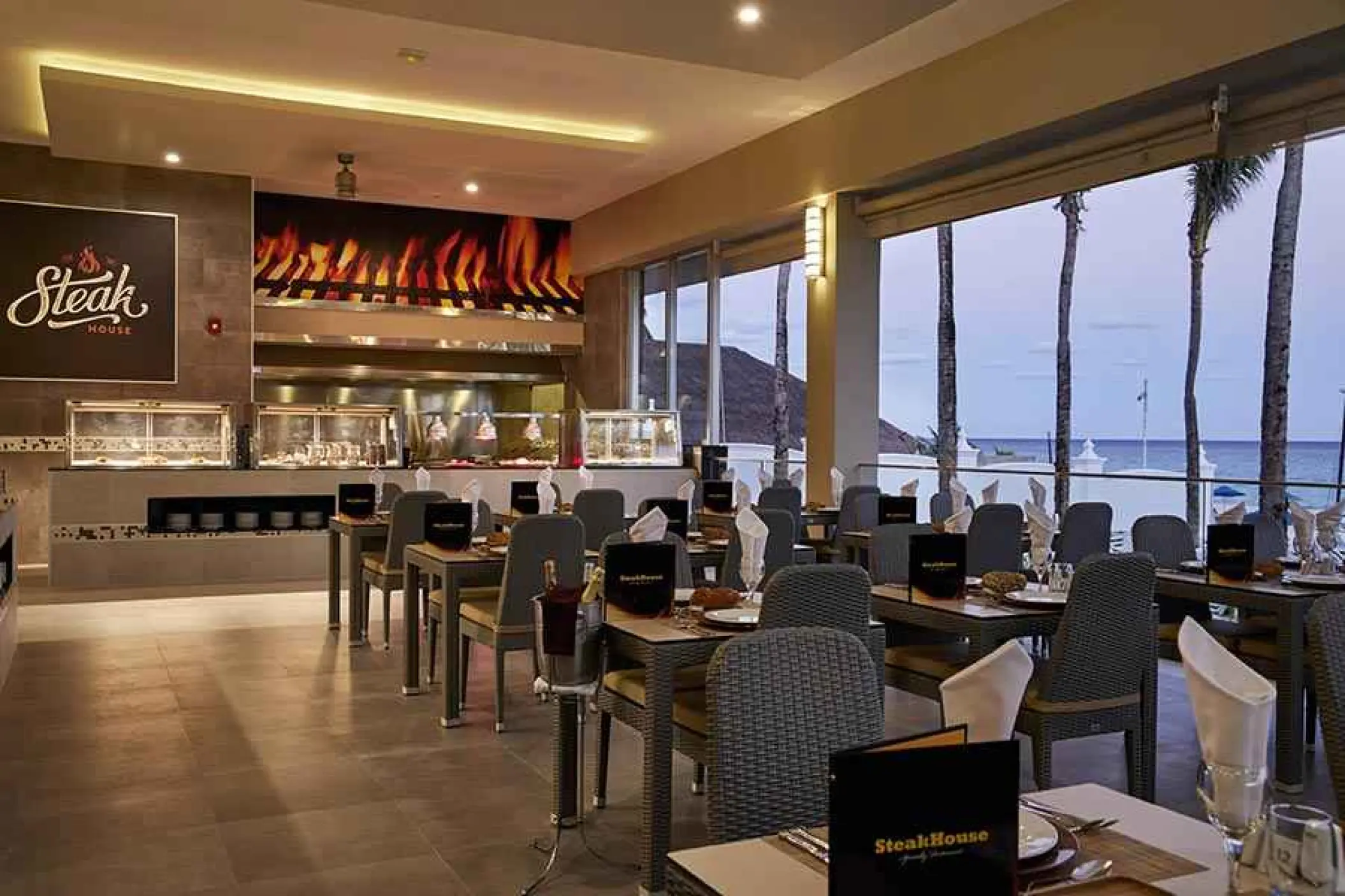 Steakhouse dining room with ocean views at Riu Palace Riviera Maya, Playa Del Carmen