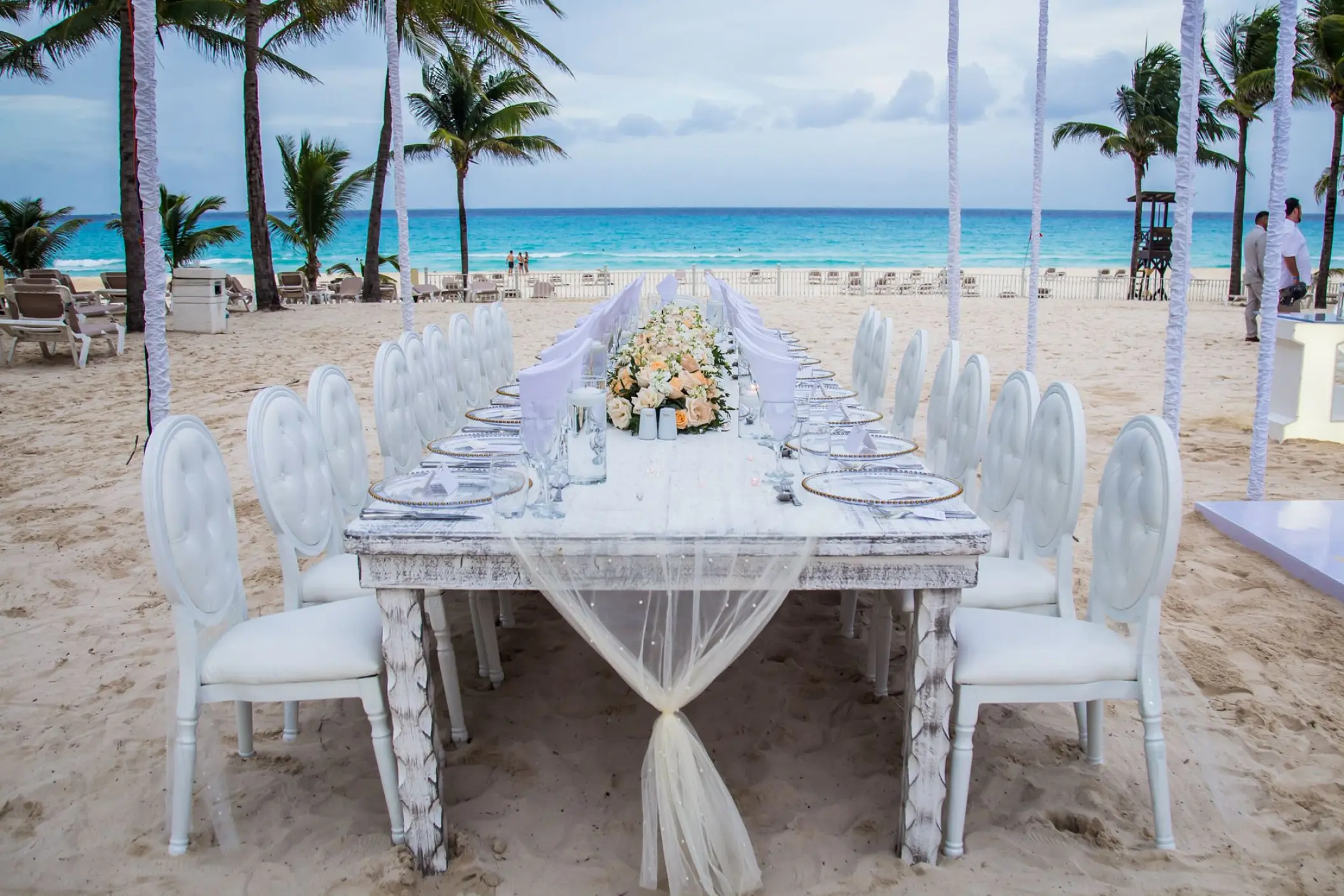 Long wedding reception table on the beach at Riu Palace Costa Mujeres, Cancun