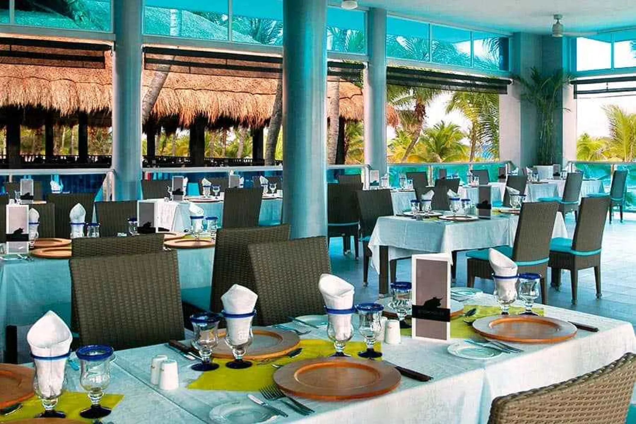 Open-air steakhouse restaurant with set tables at Riu Yucatan, Playa Del Carmen