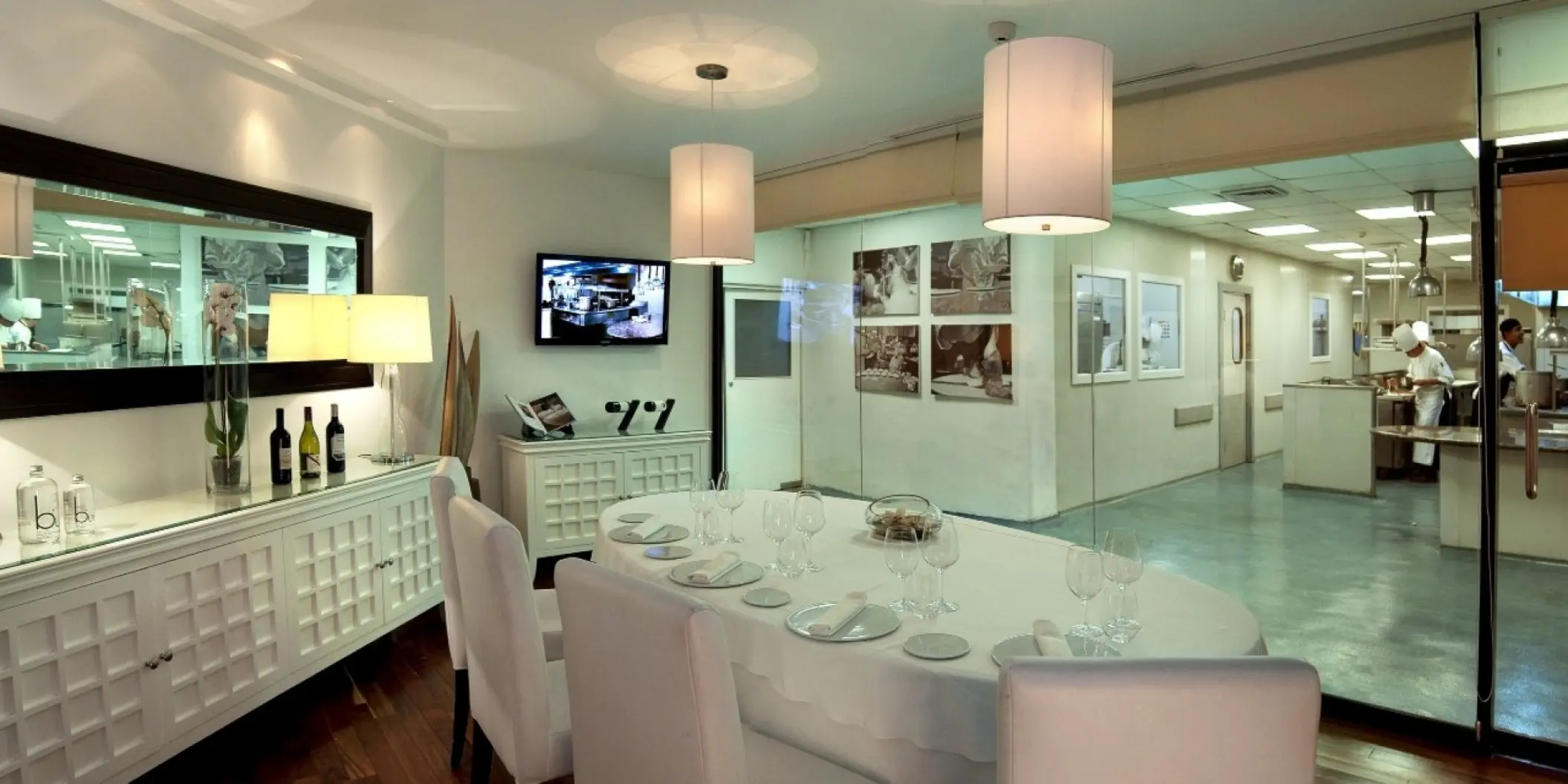 Private dining table with a view of the kitchen at Royal Hideaway Playacar, Playa Del Carmen
