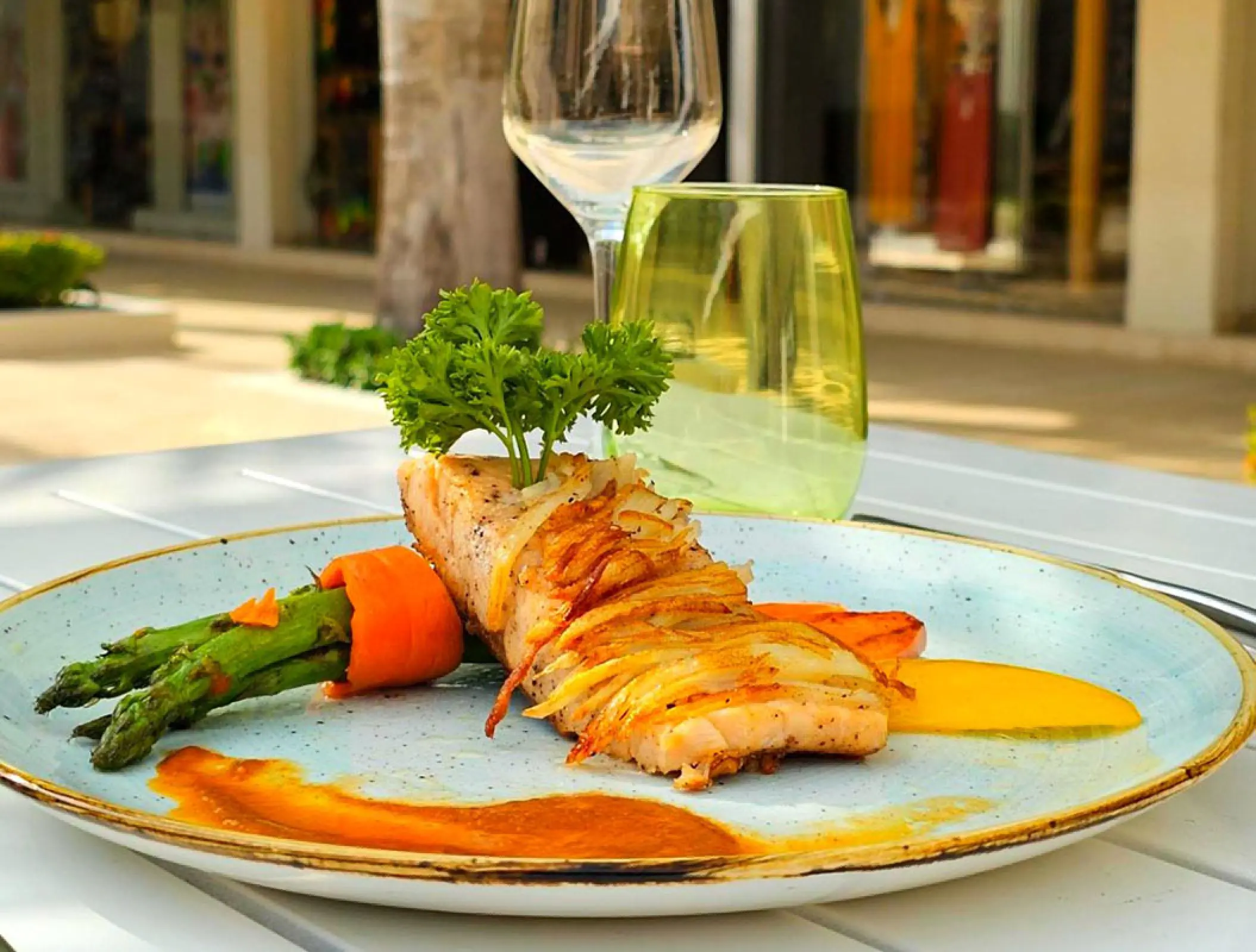 Plated salmon entree with asparagus and carrots at Royalton Blue Waters, Montego Bay